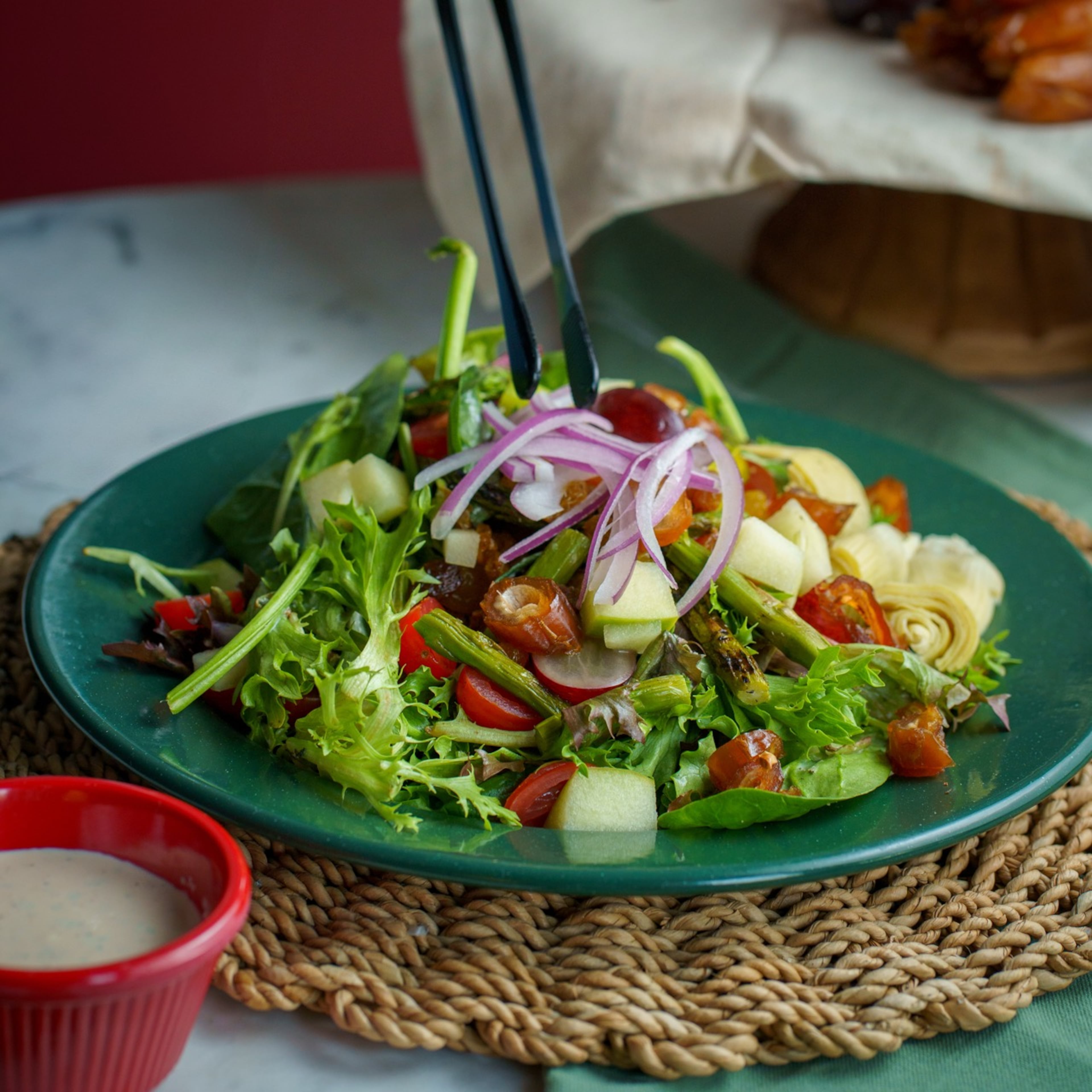 The Kitchen Sink Salad at Pritchard & Co. includes grilled asparagus, dates, golden raisins, marinated artichokes, green apple, red grapes, red onion, housemade croutons, grape tomatoes and buttermilk dressing. (Hitman Benny/Courtesy of Pritchard & Co.)