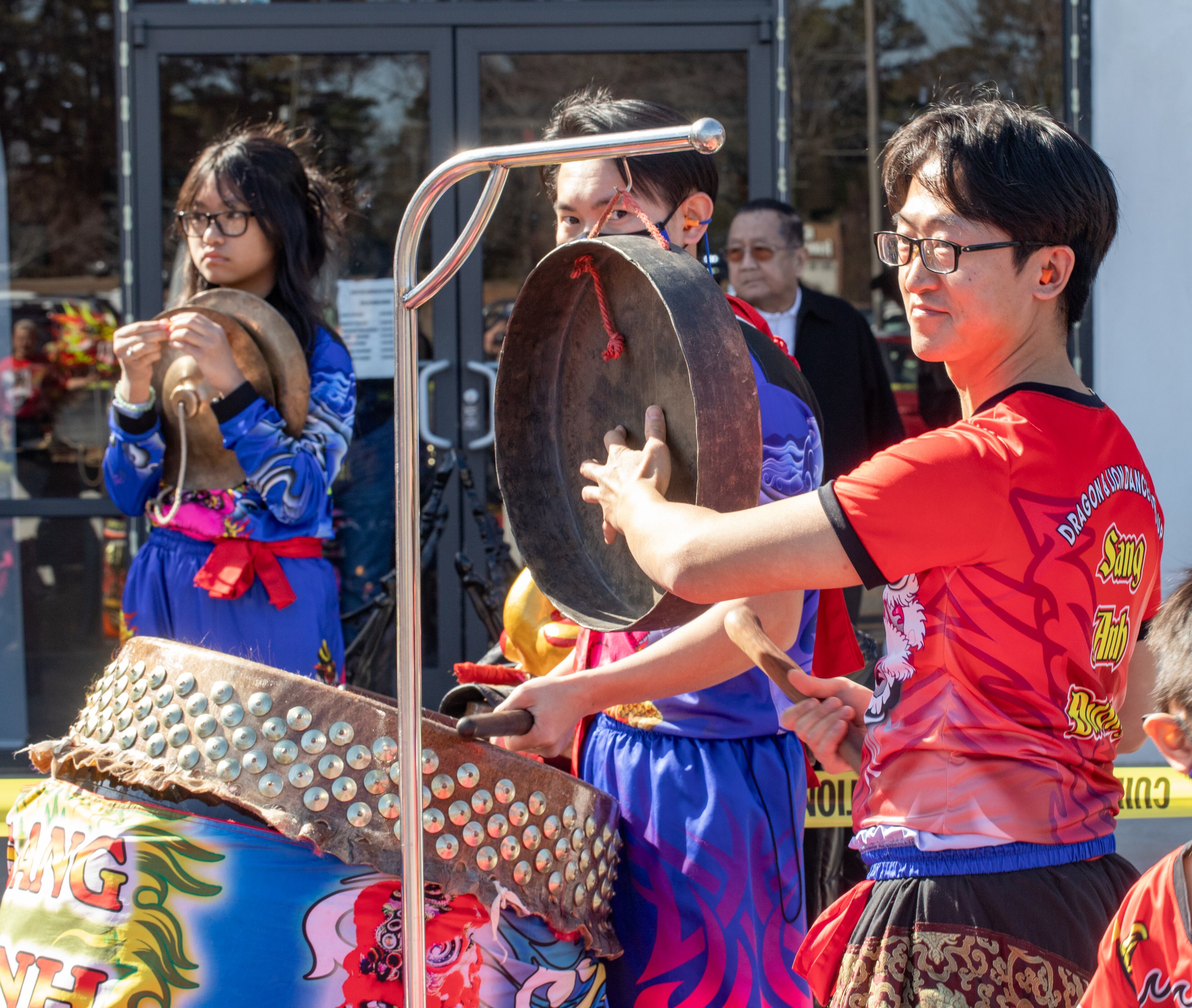Keeping the beat for the dragon dancers, Alan Theo gets ready to sound the gong and begin the performance Saturday, Feb 3, 2024. The Vietnamese American Community of Georgia hosts a Lunar New Year celebration at Plaza Las Americas in Lilburn where dragon and lion dancing begins the weekend. The celebration continues on Sunday and includes traditional food, music and cultural festivities. (Jenni Girtman for The Atlanta Journal-Constitution)