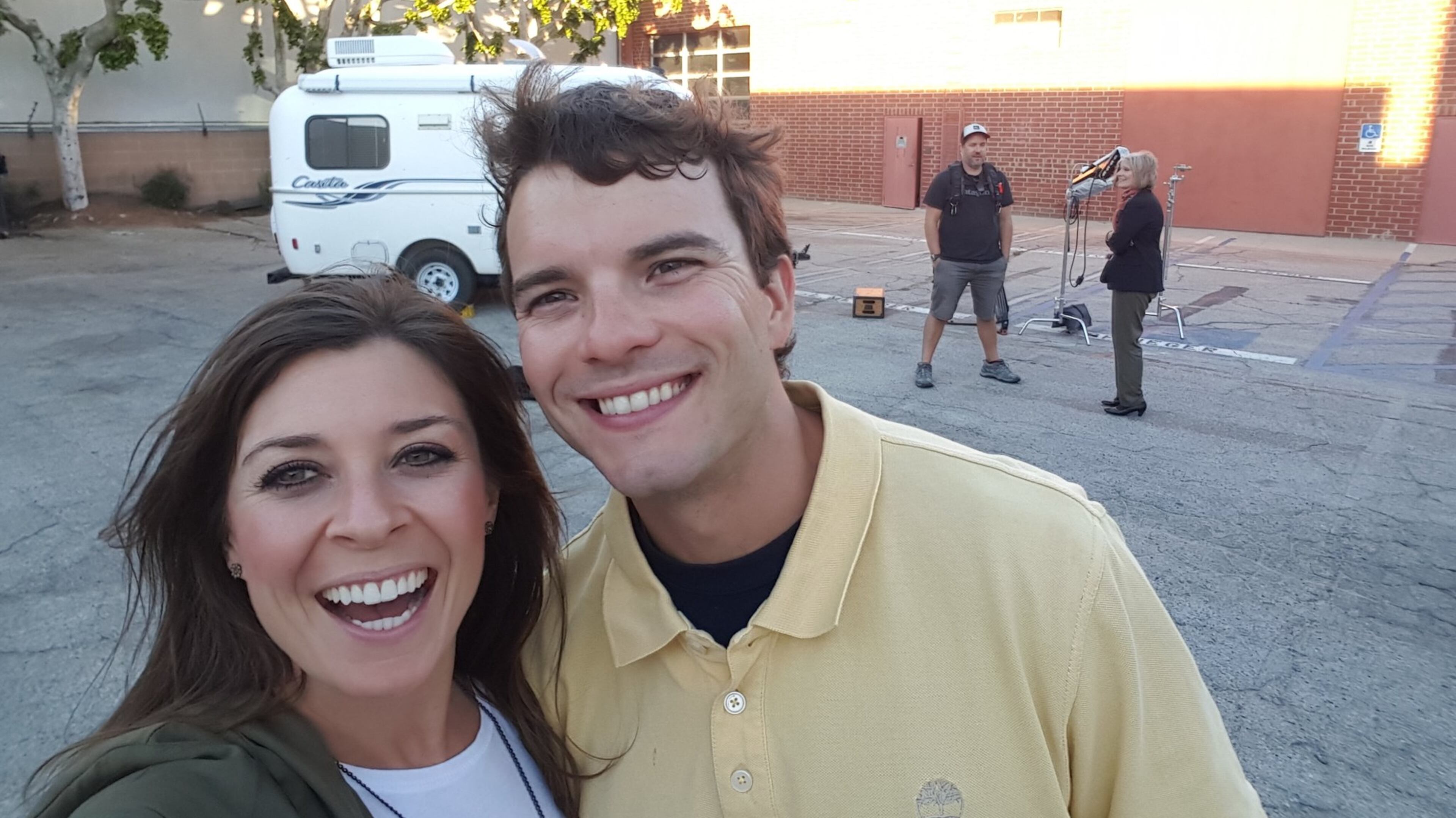 Lindsey Nubern (left) takes a selfie with her husband, Adam Nubern, outside the little white camper they were considering, during a break in filming for an episode of HGTV’s “Tiny House Hunters.” The episode with the Nuberns, both University of Georgia graduates, will air again on May 2. CONTRIBUTED PHOTO
