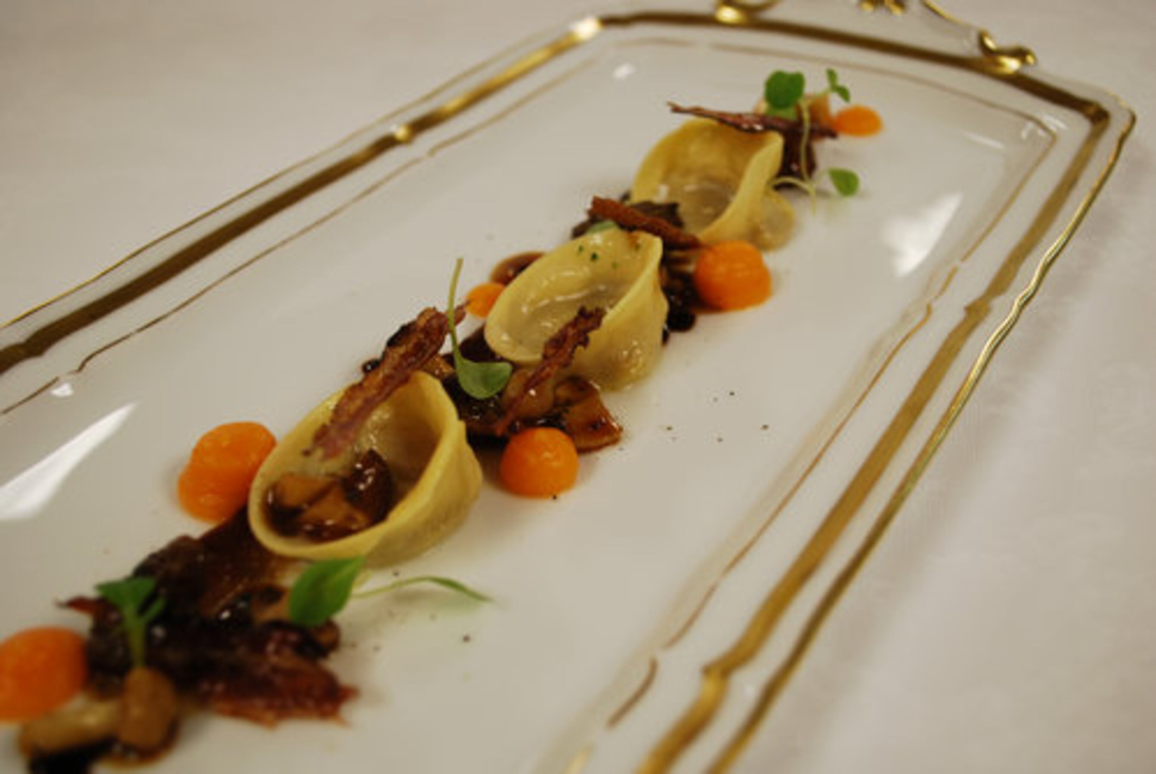 From the menu at the Georgian Room: Foie gras tortellini with sherry vinegar jam and butternut squash puree.