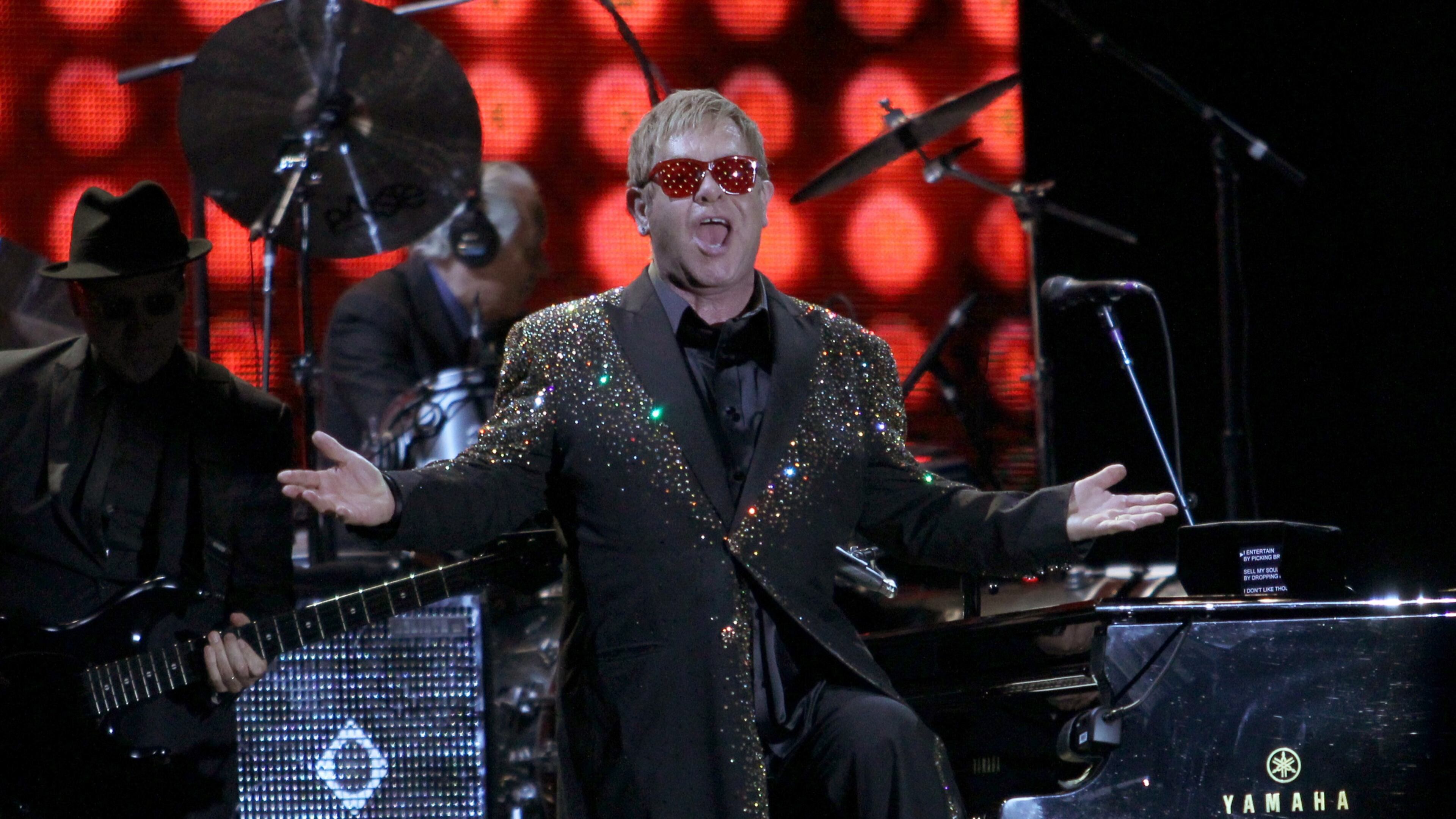 The legendary Sir Elton John greets the audience at the opening of his performance at the 2015 annual Music Midtown music festival on Friday. John announced he will be writing his memoir, to be published in 2019. Photo: Akili-Casundria Ramsess.