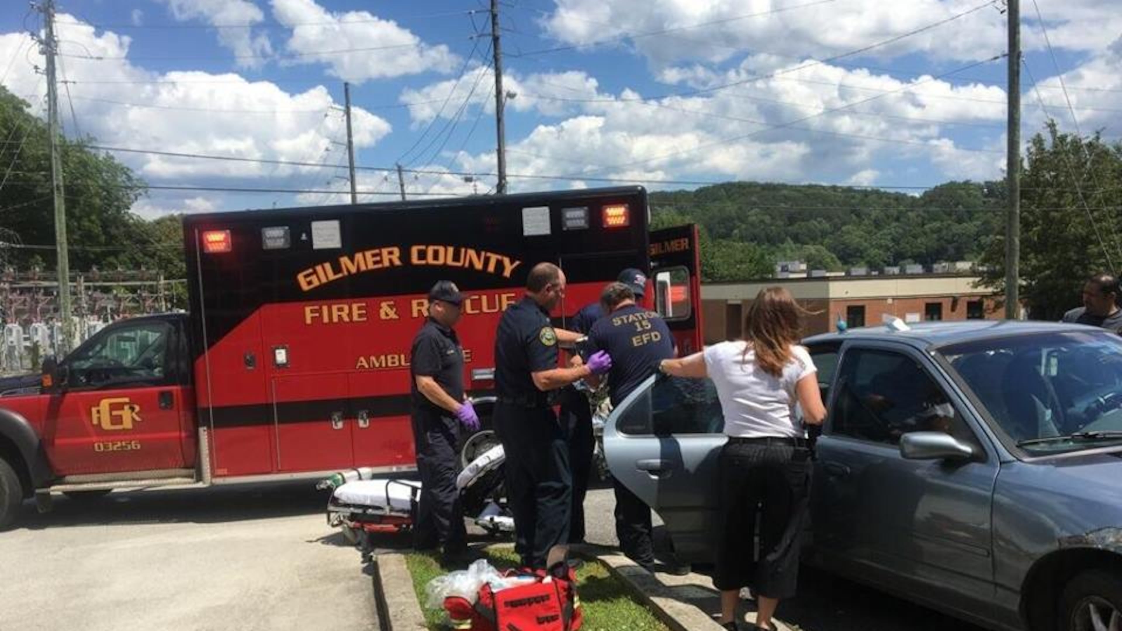 Firefighters gather in the fire house parking to help deliver a baby. Firefighter Gene Hightower helped deliver the baby girl in the back seat of the couple’s car. (Credit: Ellijay Fire Department)
