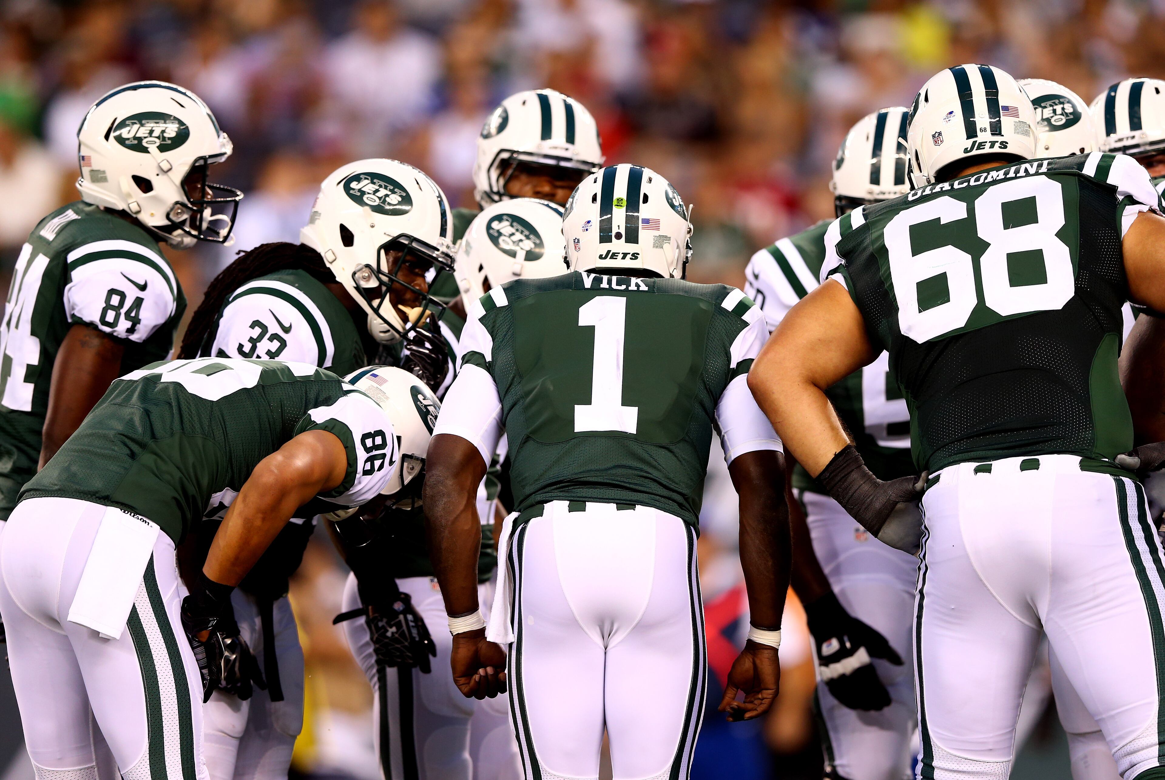Quarterback Michael Vick #1 of the New York Jets calls a play in the hudlde against the Indianapolis Colts during a preseason game at MetLife Stadium on August 7, 2014 in East Rutherford, New Jersey. (Photo by Elsa/Getty Images)