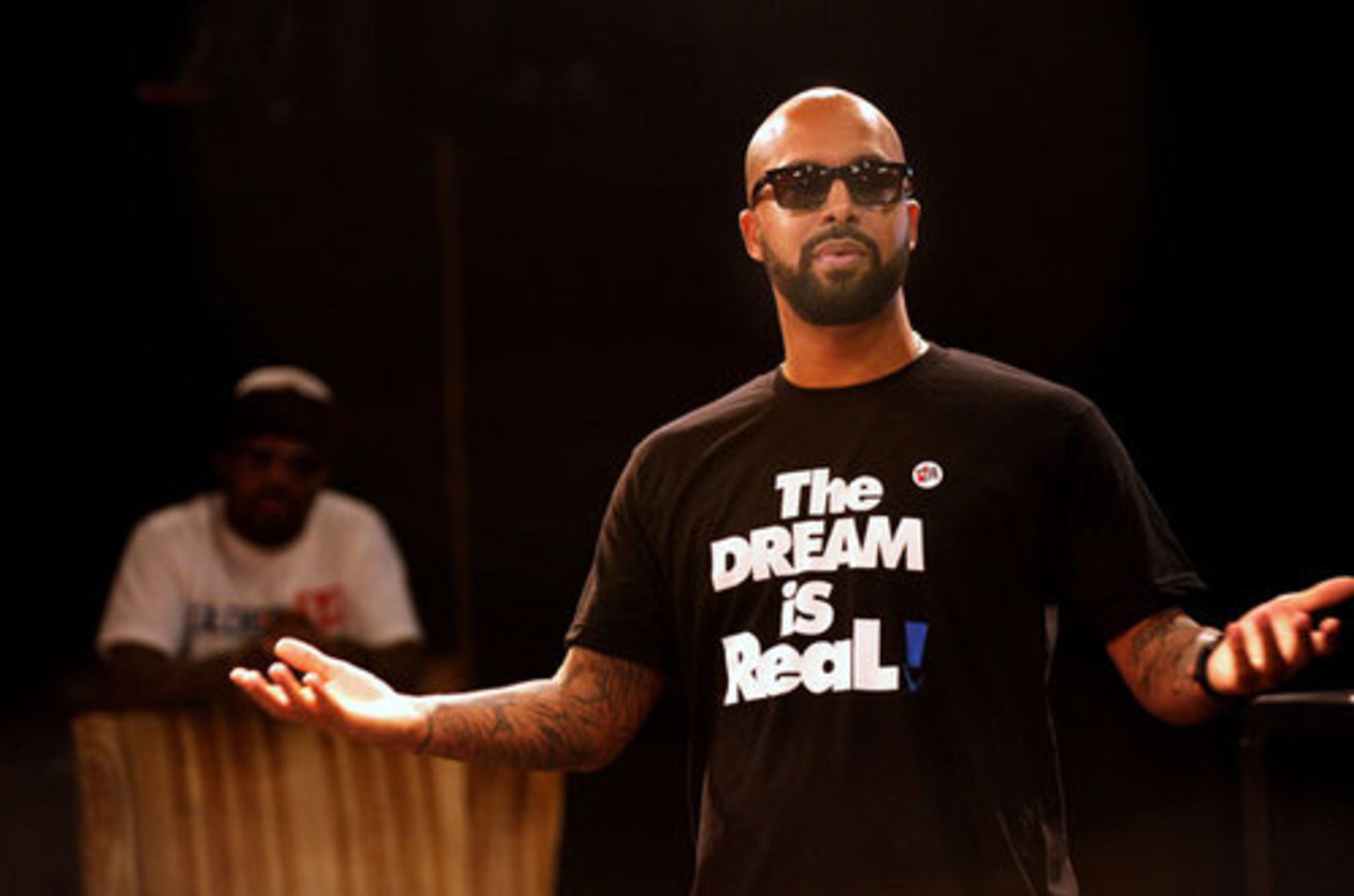 V103FM personality Kenny Burns talks to students during the during the Rock the Vote Democracy Class.