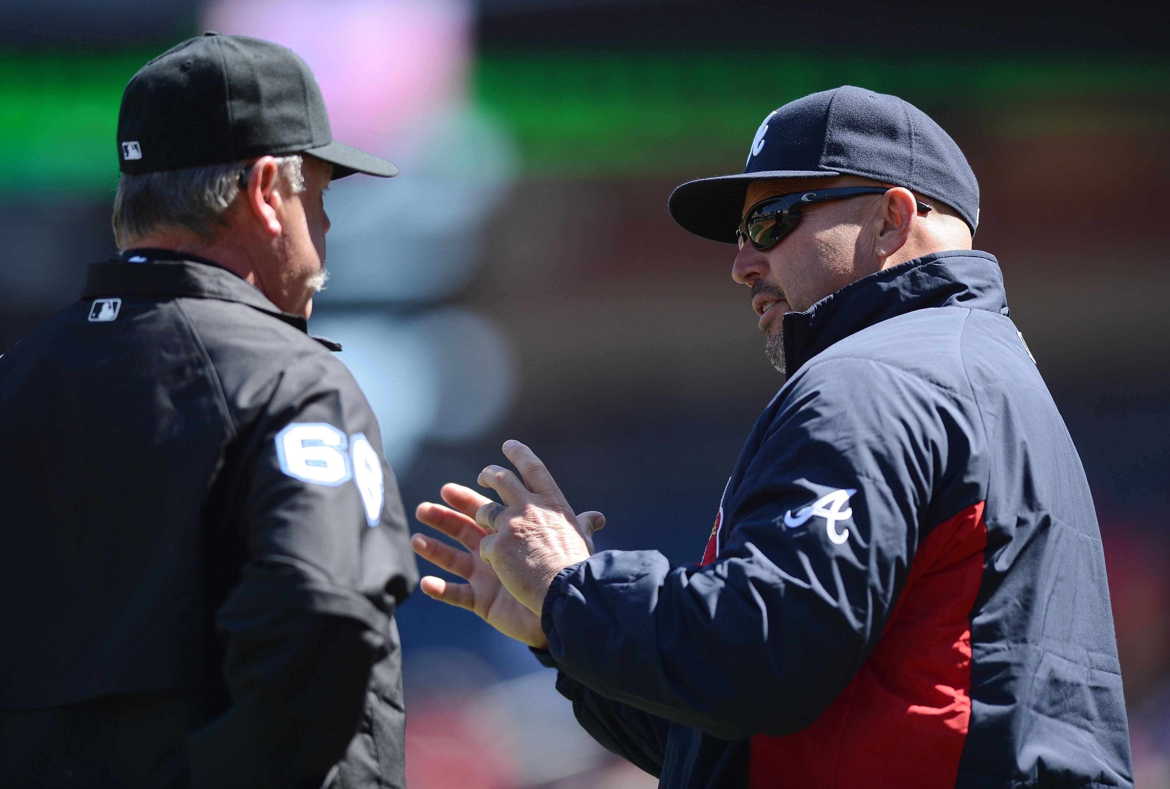 Atlanta Braves manager Fredi Gonzalez, right, speaks with third base umpire Jim Joyce between innings in the game against the Washington Nationals at Nationals Park in Washington, D.C., Sunday, April 6, 2014. (Chuck Myers/MCT)