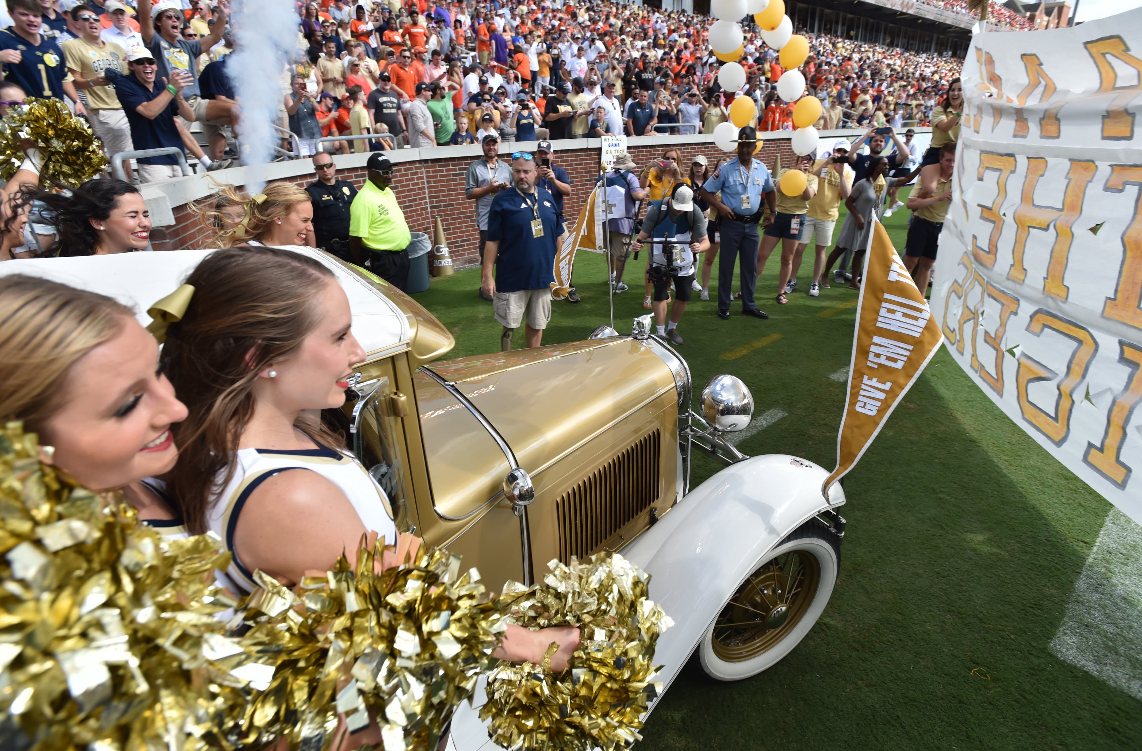 September 22, 2018 Atlanta - Georgia Tech's Ramblin' Wreck leads the band, cheerleaders, Buzz, players, and coaches before the start of the Georgia Tech home game against the Clemson at Bobby Dodd Stadium on Saturday, September 22, 2018. HYOSUB SHIN / HSHIN@AJC.COM