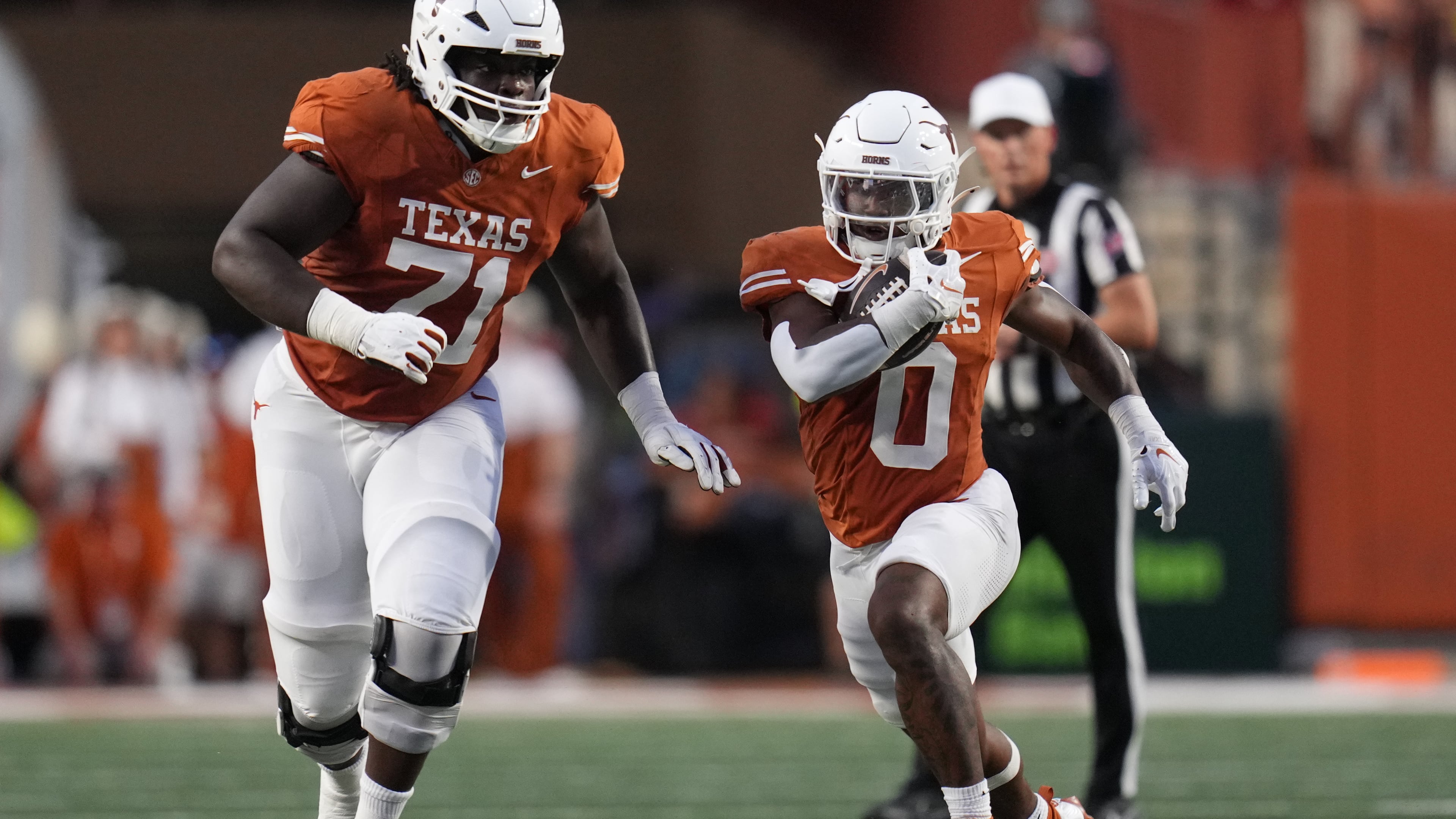 Texas running back Raleek Brown (0) runs against Ohio State during the first half of an NCAA college football game in Austin, Texas, Saturday, Sept. 12, 2026. (AP Photo/Eric Gay)