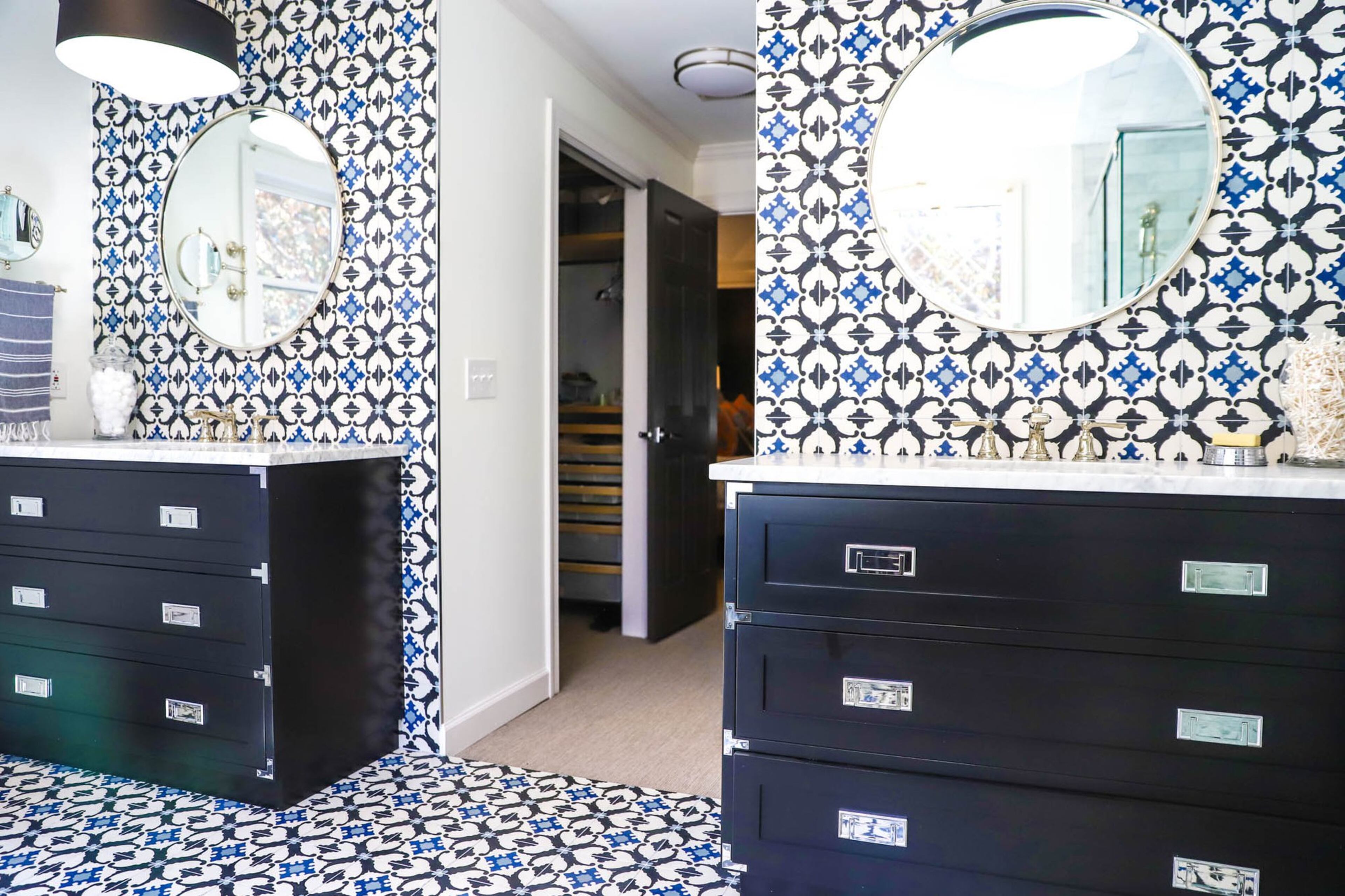 Campaign-style vanities give the master bathroom of Scott and Sabrina Serafin’s Virginia-Highland home a subtle flair, while the encaustic cement tiles create visual interest on the walls and floor. Text by Shannon Dominy. Photo by Reynolds Rogers.