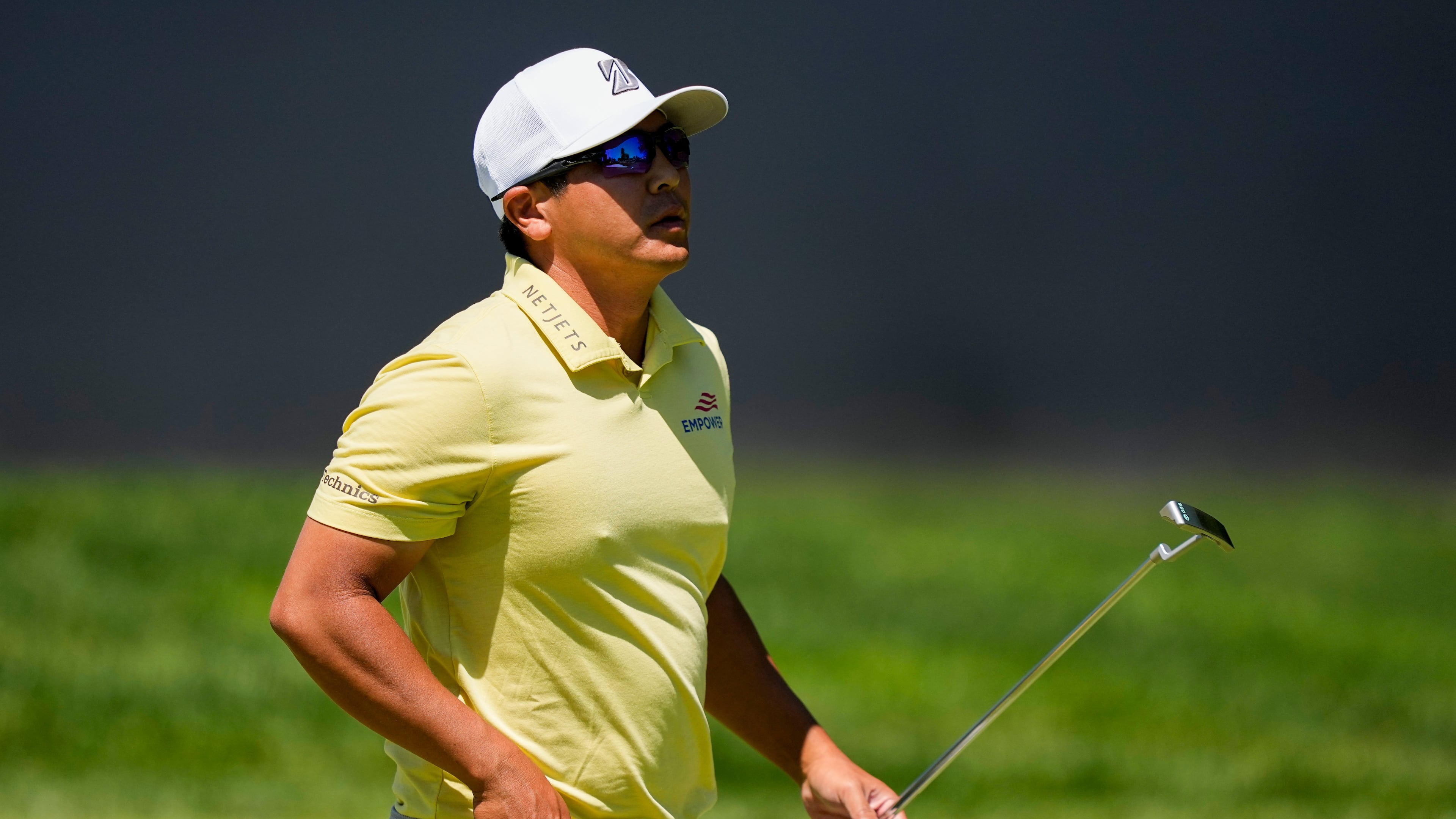 Kurt Kitayama walks across the first green after his shot during the third round of the PGA Championship golf tournament at Aronimink Golf Club, Saturday, May 16, 2026, in Newtown Square, PA. (AP Photo/Matt Slocum)