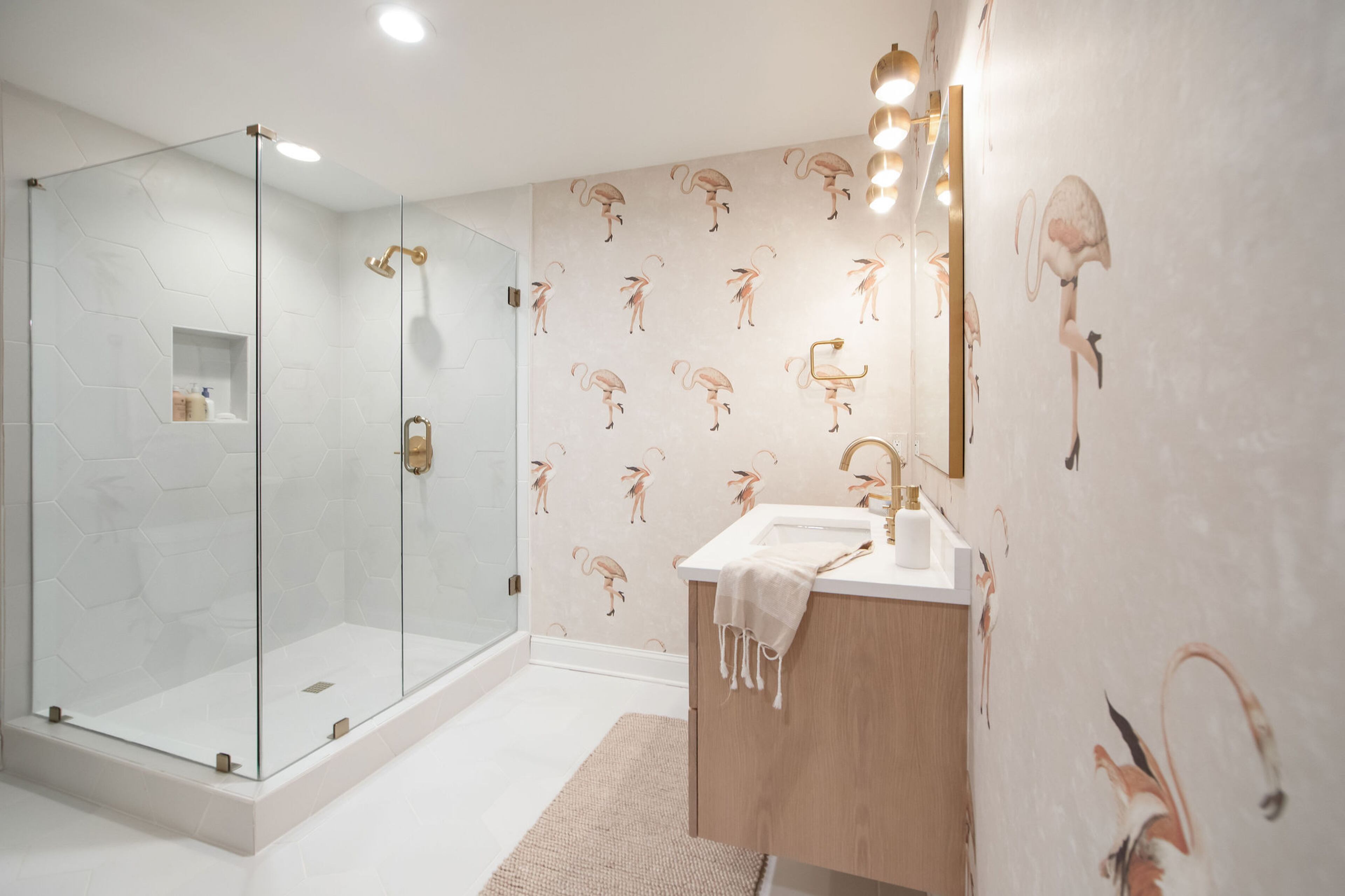 This bathroom in the basement is a fun place to towel off or after a dip in the pool or in-ground hot tub outside, thanks in large part to the flamingo wallpaper from Anthropologie. “No one goes in there and doesn't smile and laugh about the wallpaper and have a good time. It's so playful,” Rachel Nelson says. Text by Lori Keong/Photo by Amanda Winchester