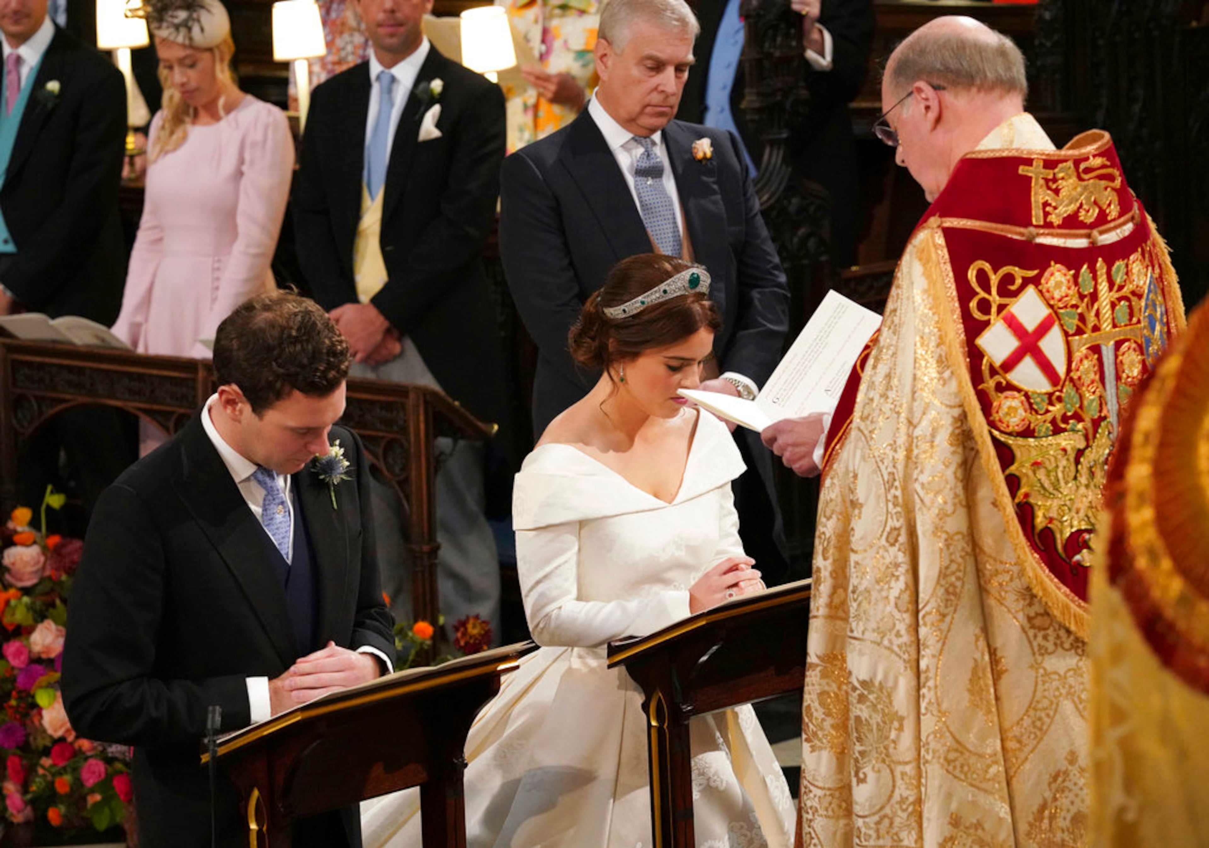 The Rt Revd David Conner, Dean of Windsor conducts the wedding ceremony between Princess Eugenie of York and Jack Brooksbank in St Georgeâs Chapel, Windsor Castle, near London, England, Friday Oct. 12, 2018. (Jonathan Brady, Pool via AP)
