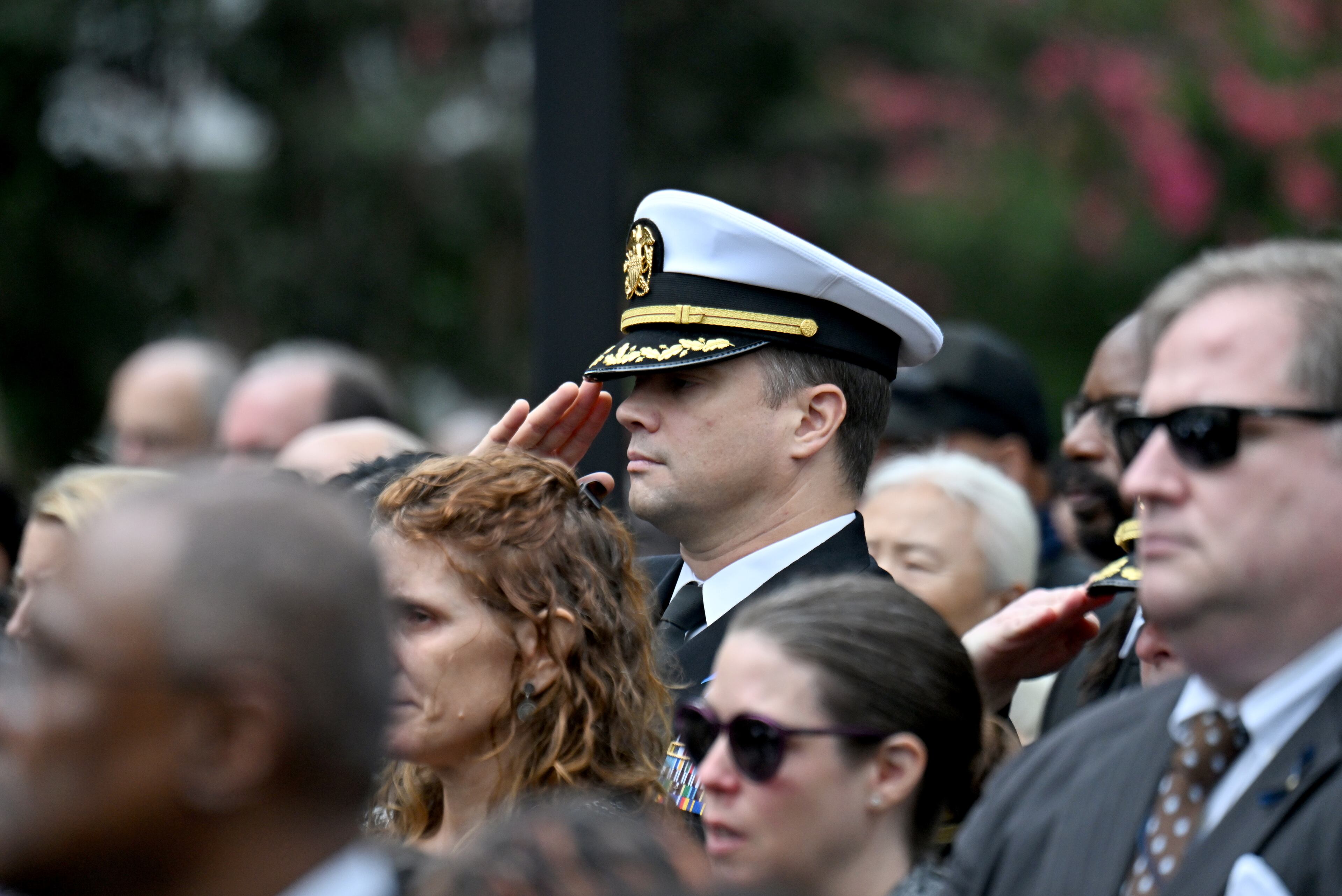 A mourner from Department of Health Services salutes during the Final Honors following the memorial service for DeKalb County police Officer David Rose, who was killed while responding to the Aug. 8 shooting at the CDC, outside the First Baptist Church Atlanta, Friday, August 22, 2025, in Atlanta. Hyosub Shin / AJC)