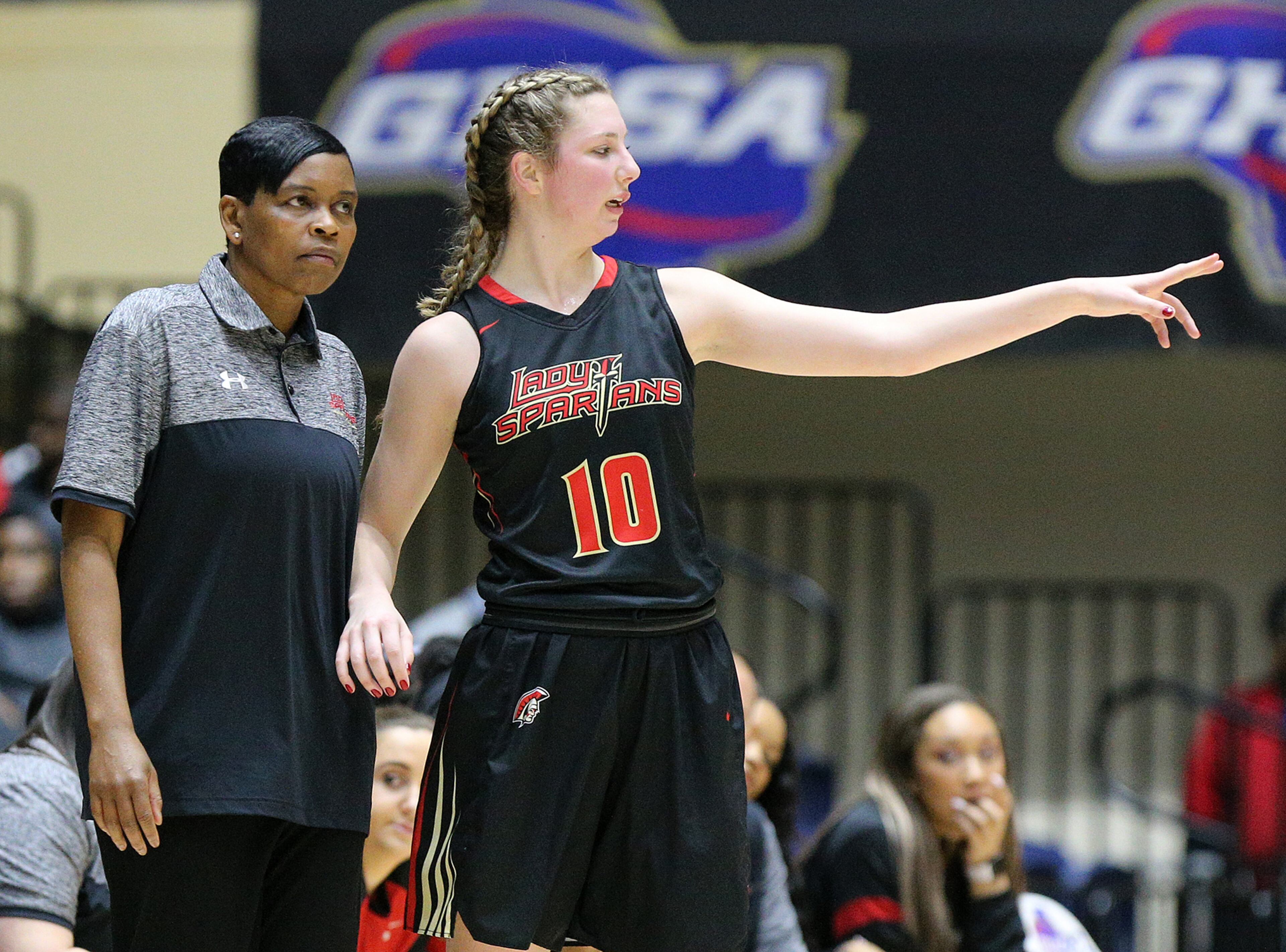 March 8, 2018 Macon: GAC Head coach Lady Grooms confers with center MaryMartha Turner during the first half against Johnson-Savannah in their GHSA state basketball championship game on Thursday, March 8, 2018, in Macon. Curtis Compton/ccompton@ajc.com