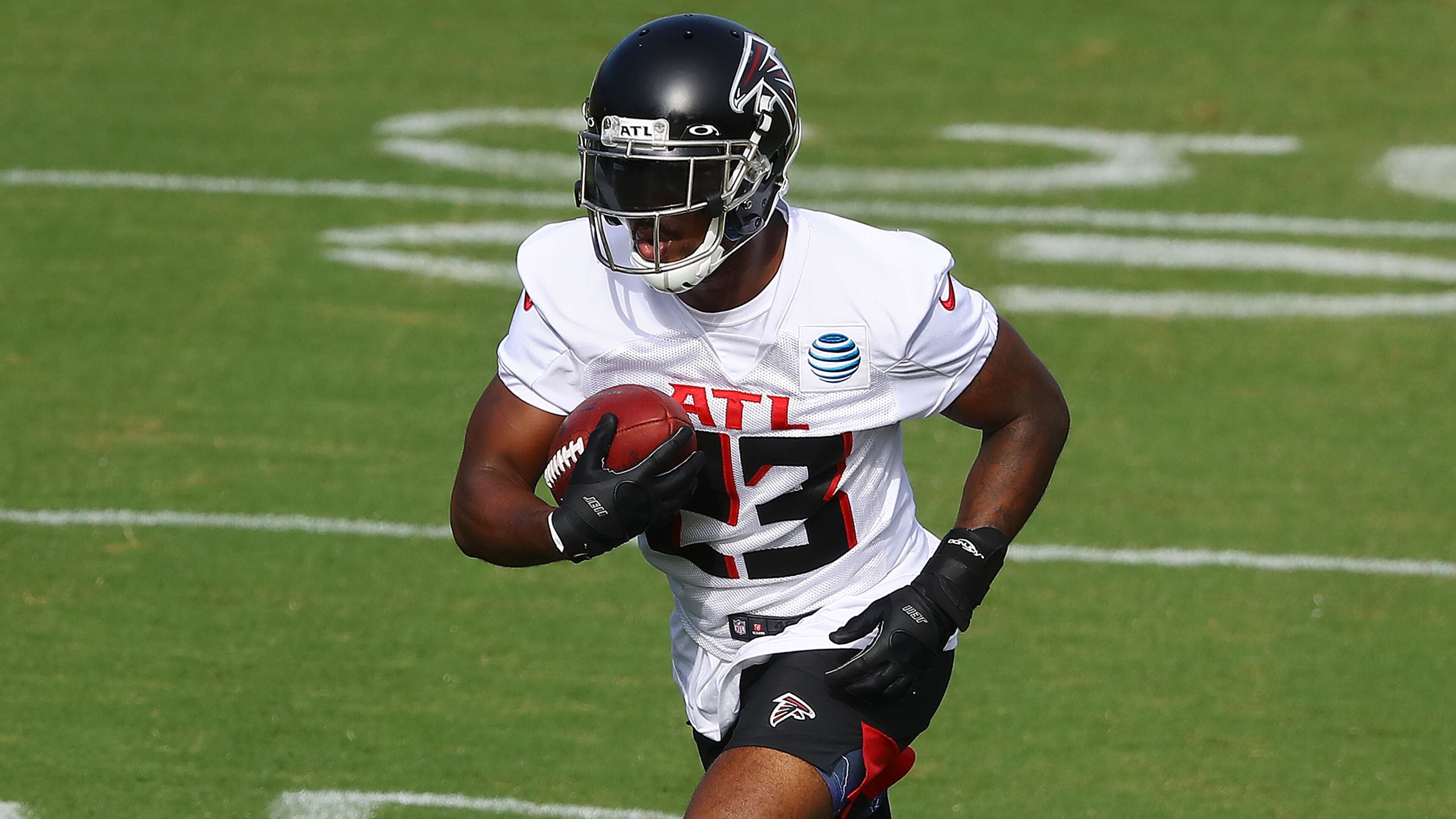 Falcons running back Brian Hill carries the ball during training camp on Thursday, August 27, 2020 in Flowery Branch. Curtis Compton ccompton@ajc.com
