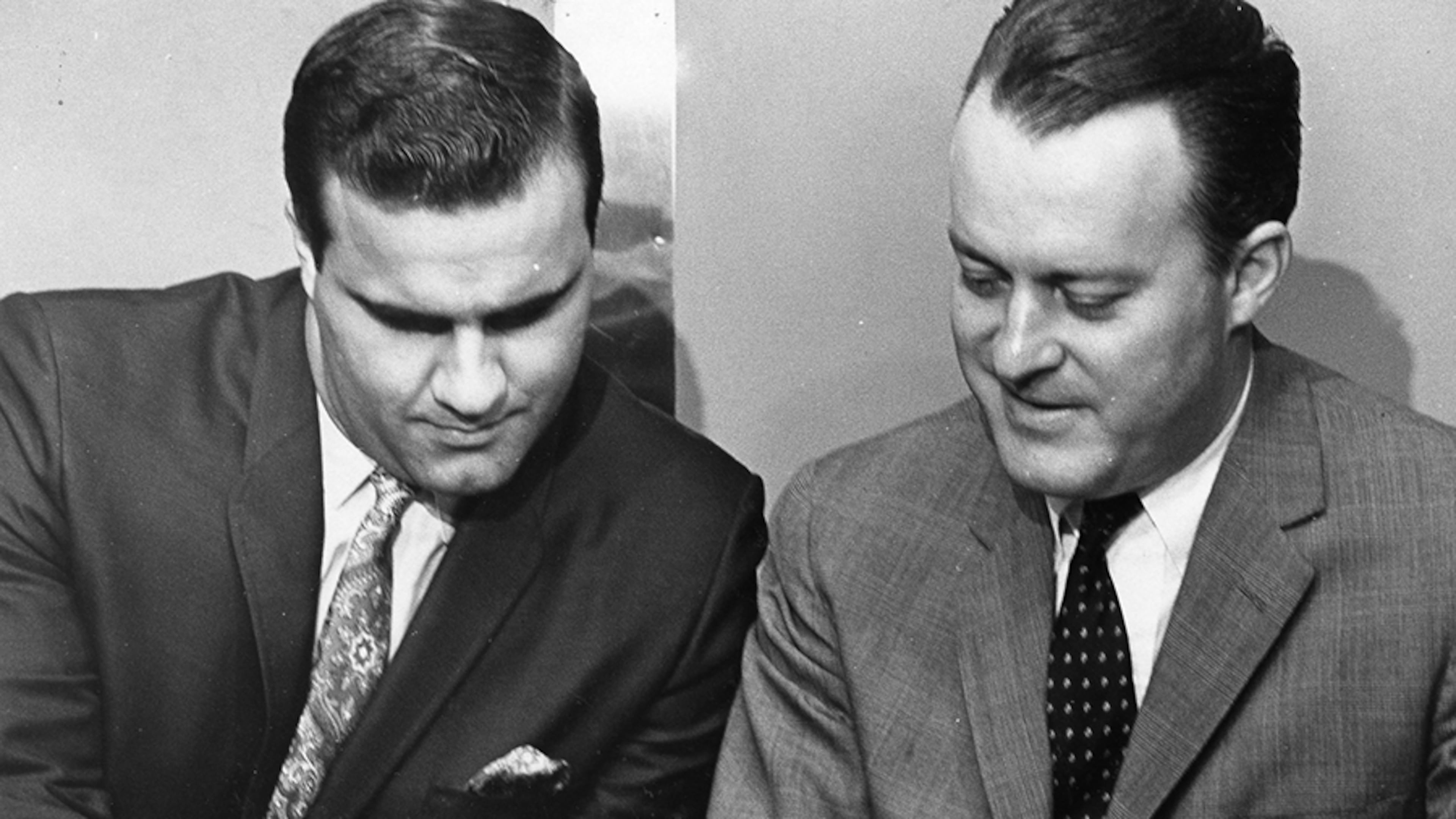 Braves owner Bill Bartholomay, right, watches catcher Joe Torre sign a new contract in 1967, signed Joe Torre to a new contract. The eventual Hall of Fame manager became the highest paid catcher in baseball at the time at $65,000 a year.