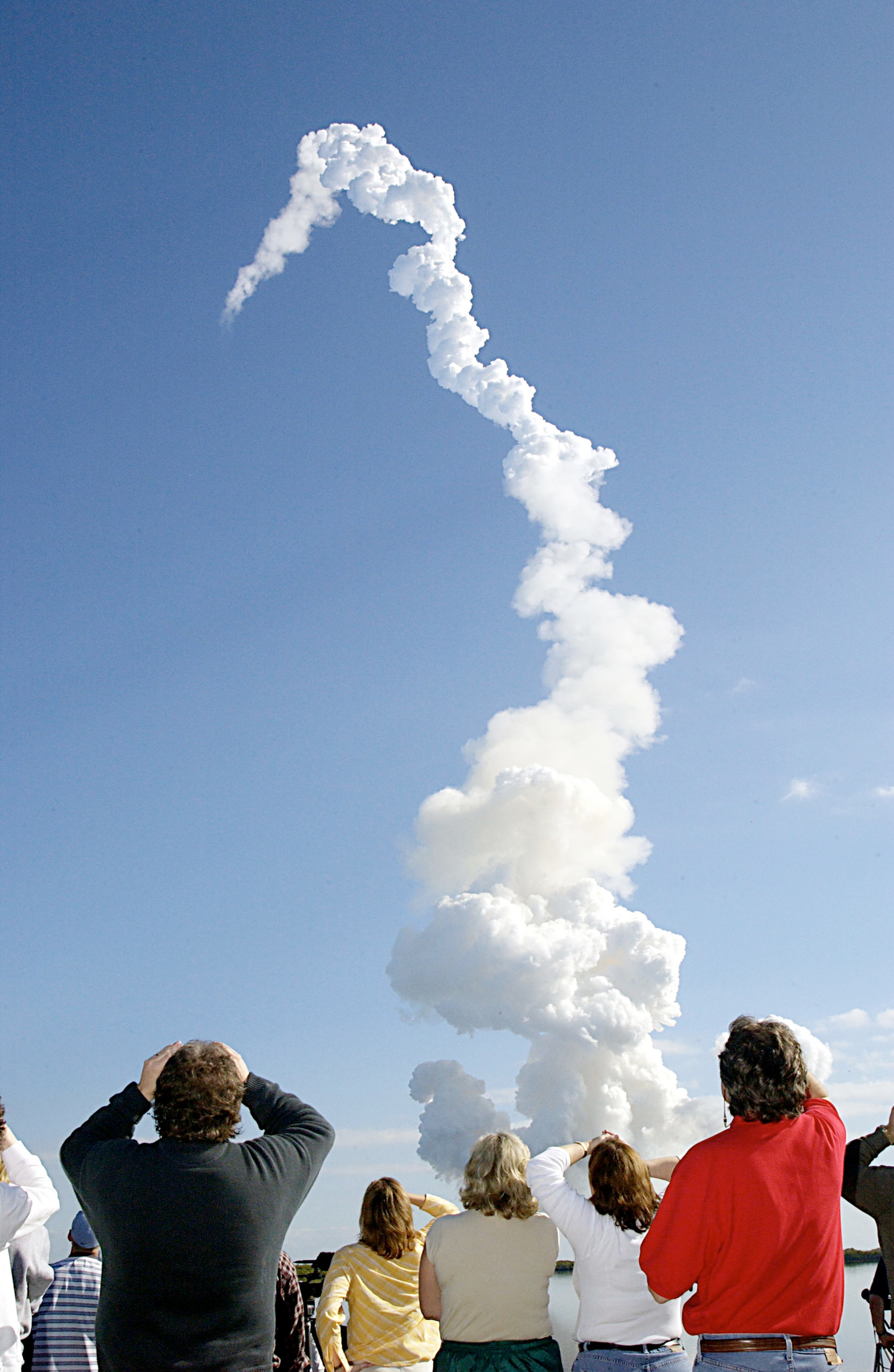 CAPE CANAVERAL, FL - JANUARY 16: (FILE PHOTO) A group of people watch as the Space Shuttle Columbia lifts off on January 16, 2003 at Cape Canaveral, Florida. NASA Mission Control lost contact with Columbia during reentry on February 1, 2003 and later learned that the shuttle had broken up over Texas. (Photo by NASA/Getty Images)
