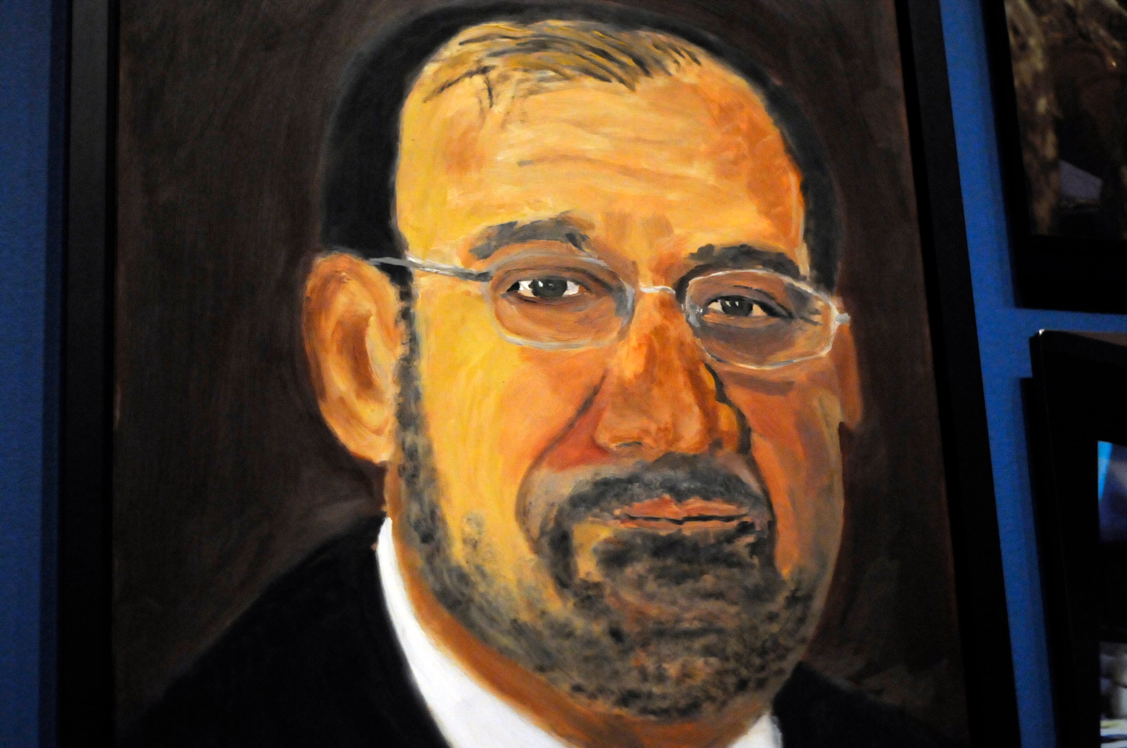 A portrait of Iraqi Prime Minister Nouri al-Maliki which is part of the exhibit "The Art of Leadership: A President's Diplomacy," is on display at the George W. Bush Presidential Library and Museum in Dallas, Friday, April 4, 2014. The exhibit of world leaders painted by former President George W. Bush opens Saturday and runs through June 3. (AP Photo/Benny Snyder)