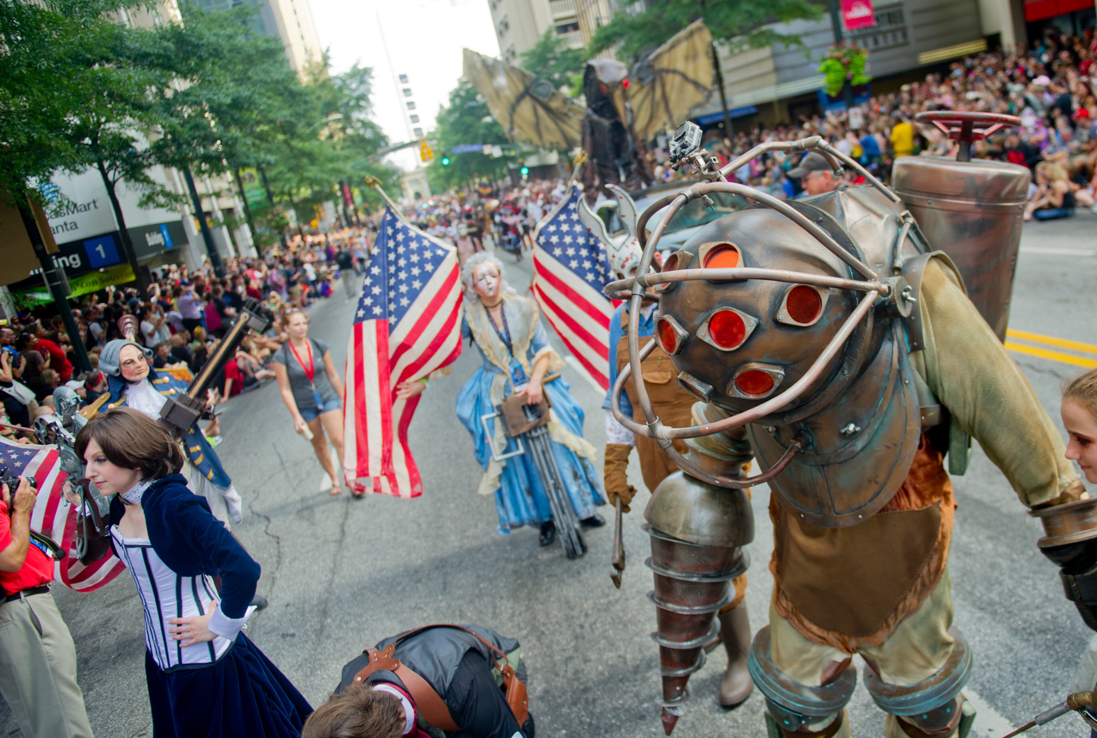 Dressed as Big Daddy, a character from the video game Bio Shock, Zach Krohne (right) marches in the annual DragonCon parade through downtown Atlanta on Saturday, August 31, 2013. This year 57,000 people were expected to attend the five day long event which is in its 27th year. JONATHAN PHILLIPS / SPECIAL
