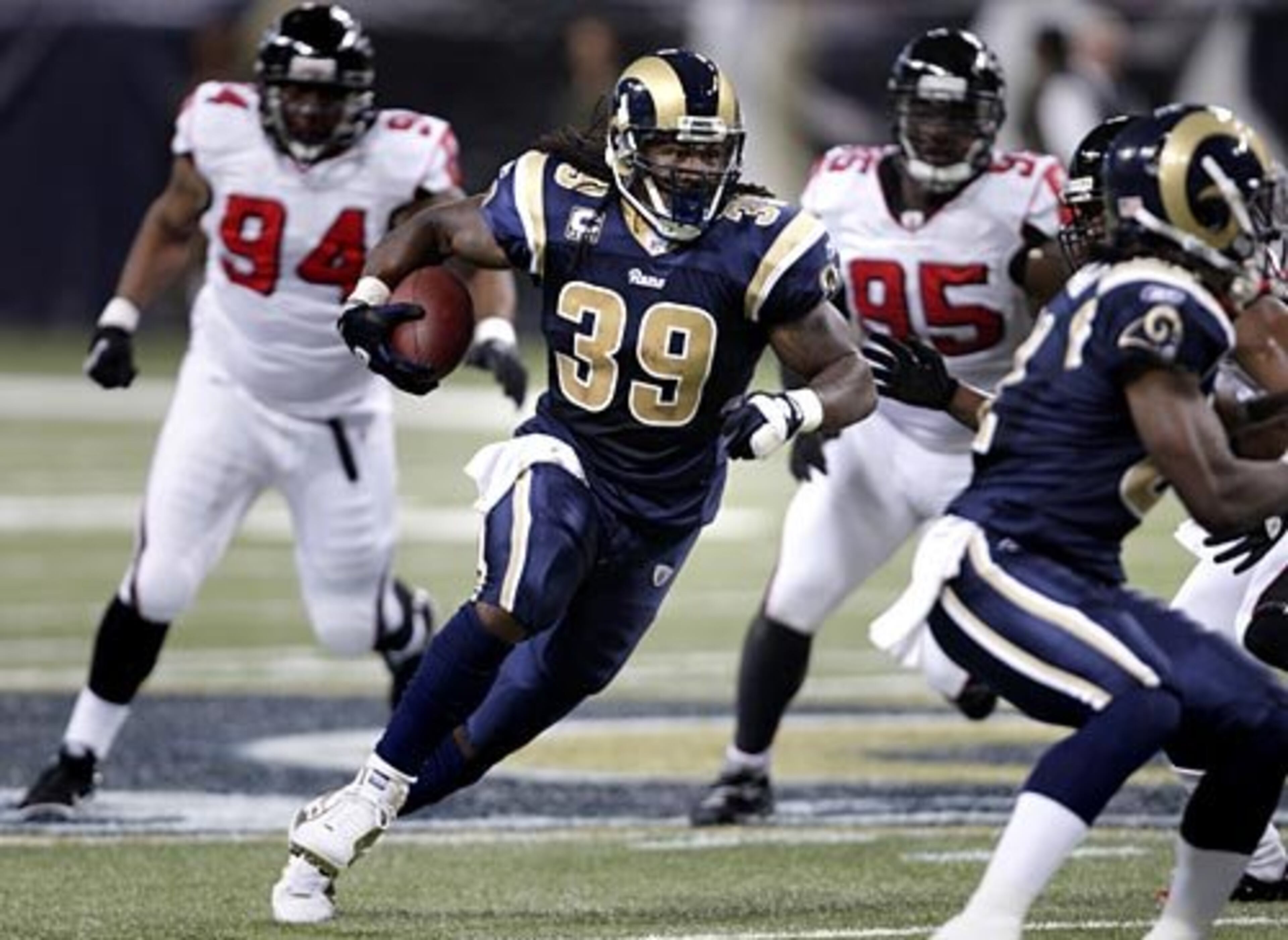 Rams running back Steven Jackson (39) carries the ball through the Atlanta Falcons defense in the first half.