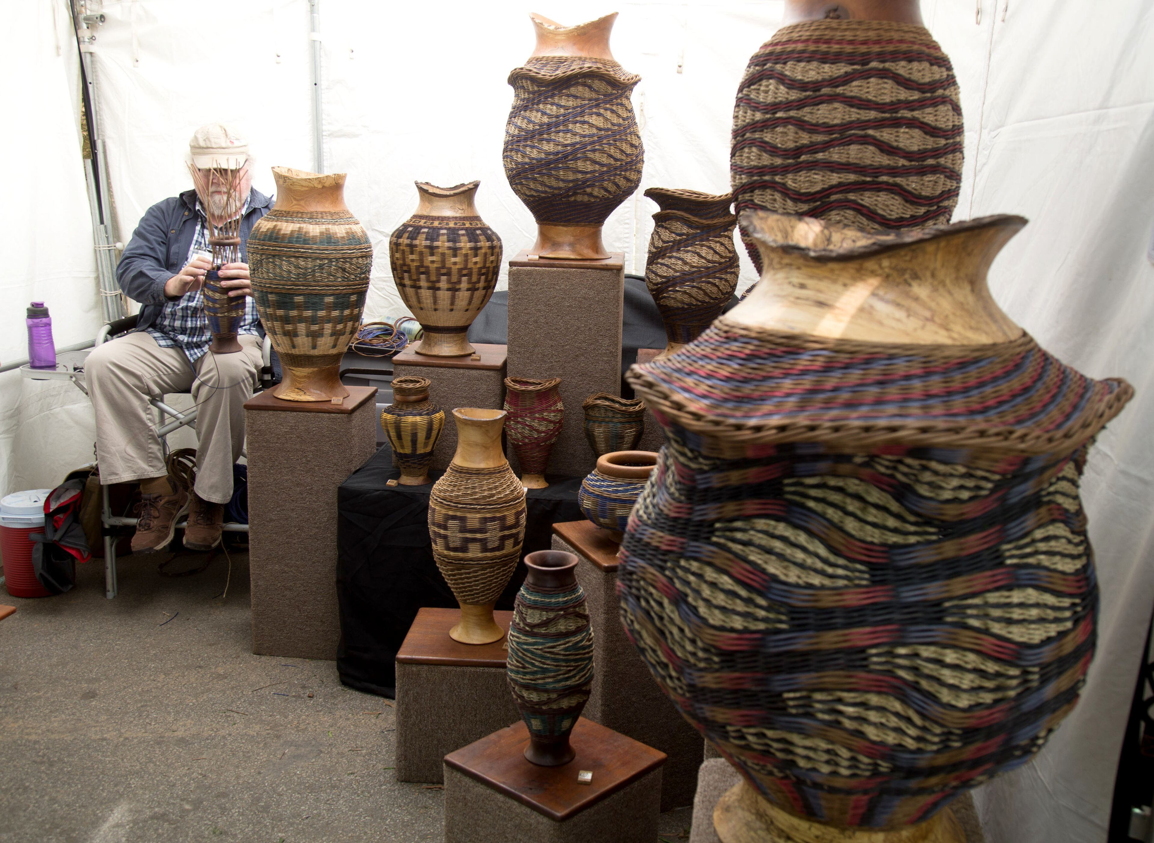 Artist Jerry Maxey works on his weaving during the 81st Annual Atlanta Dogwood Festival early Saturday in Atlanta, Ga April 8, 2017. STEVE SCHAEFER / SPECIAL TO THE AJC
