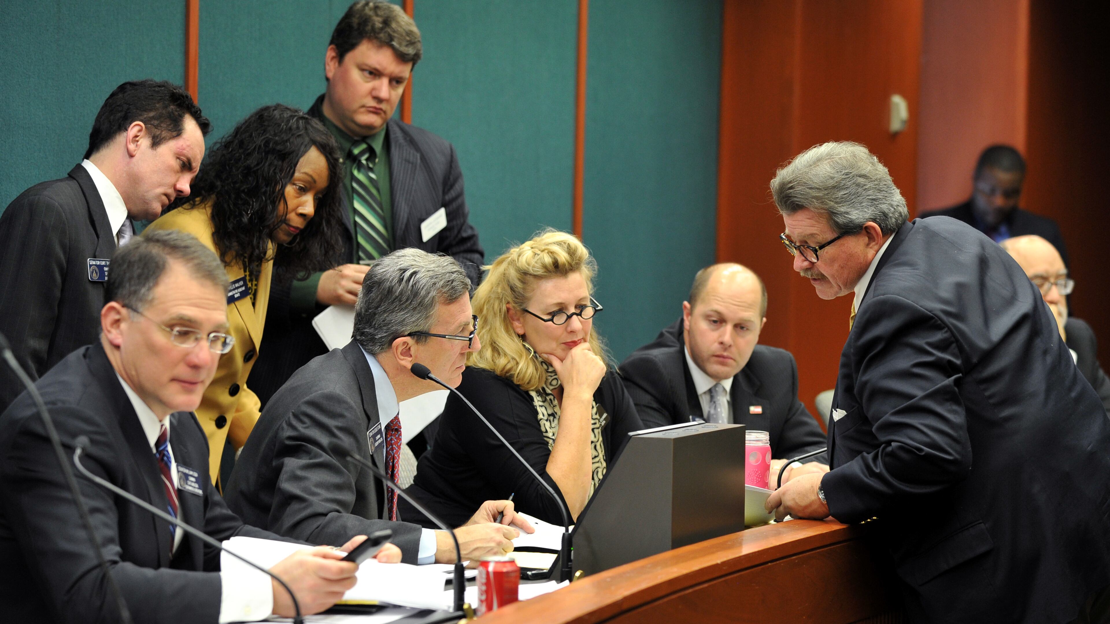 March 11, 2014 Atlanta: Rep. Alan Powell, right, co-sponsor of HB 875, the safe carry protection act, talks with Senate Judiciary Non-Civil Committee Chairman Sen. Jesse Stone Tuesday March 11, 2014. The meeting was a listening session where committee members heard from both sides of the gun bill. No vote was taken. BRANT SANDERLIN /BSANDERLIN@AJC.COM