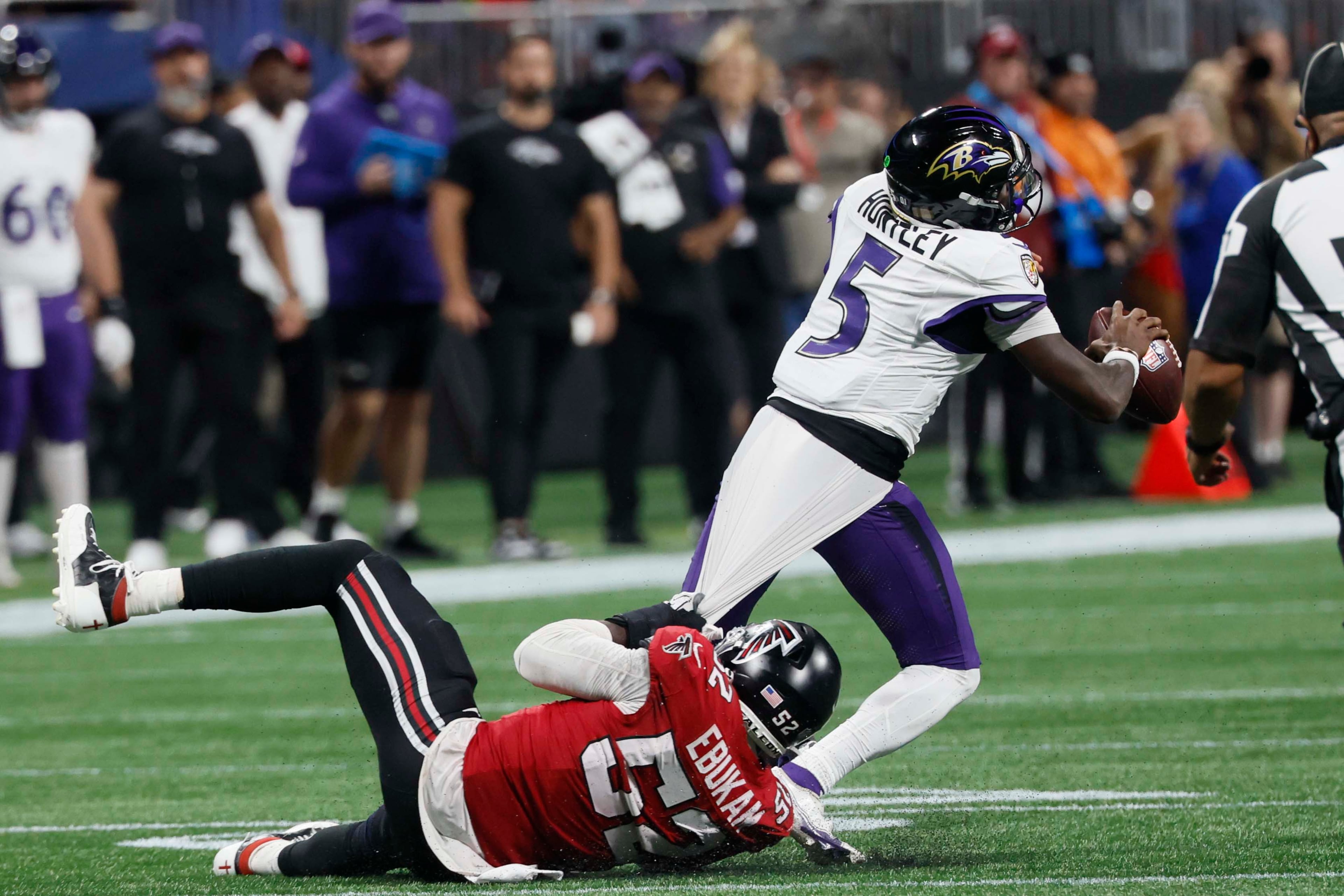 Atlanta Falcons defensive end Samson Ebukam (52) sacked Baltimore Ravens quarterback Tyler Huntley (5) during the second half of a football game against the Ravens at Mercedes-Benz Stadium in Atlanta, GA, Sunday, Oct. 11, 2026. (Miguel Martinez/AJC)
