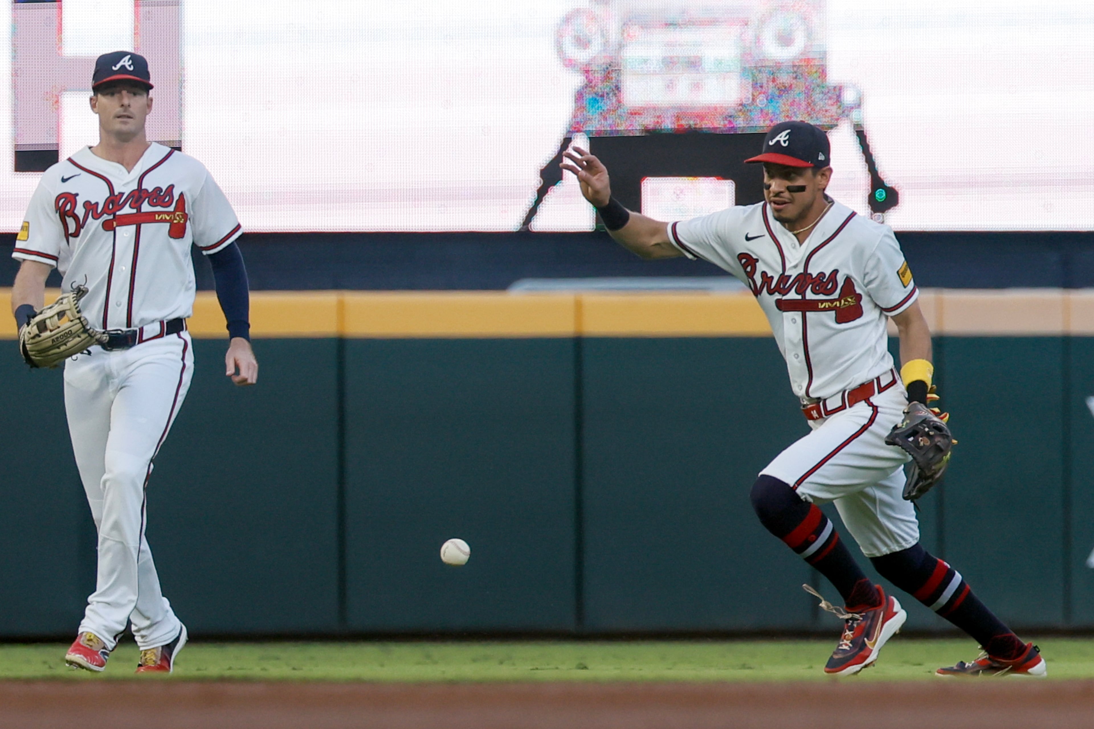 Atlanta Braves shortstop Mauricio Dubon (14) misses catching a shallow fly ball hit by Los Angeles Dodgers' Max Muncy, allowing a run to score, during the second inning of Game 4 of the MLB National League Division Series between the Atlanta Braves and the Los Angeles Dodgers, Wednesday, Oct. 7, 2026, in Atlanta. (Miguel Martinez/AJC)