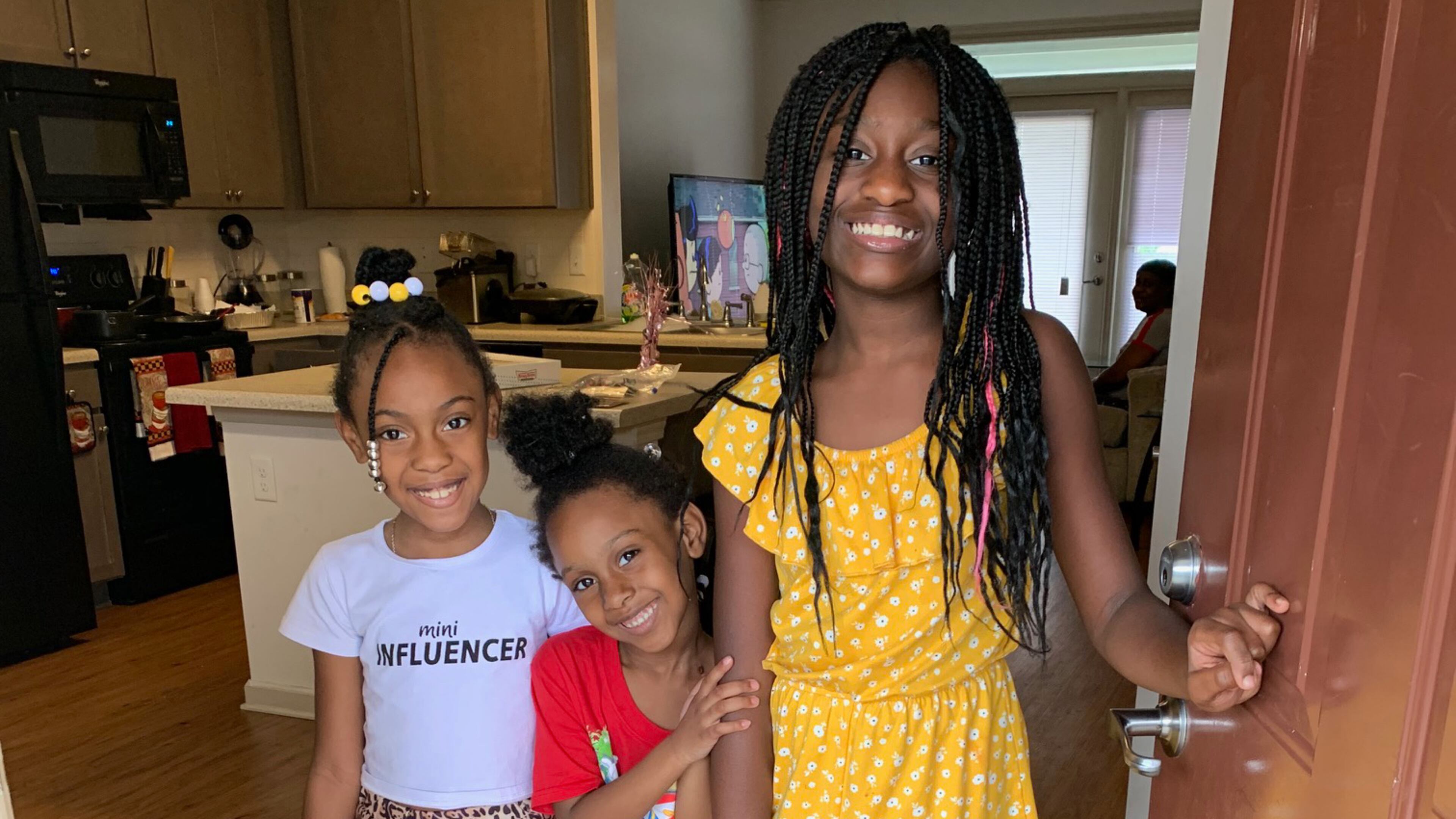 Children who live at a Columbia Residential property pose with their backpacks and school supplies, provided through Columbia Residential's 2020 Backpack and School Supplies Knock-and-Drop giveaway. Courtesy of Columbia Residential