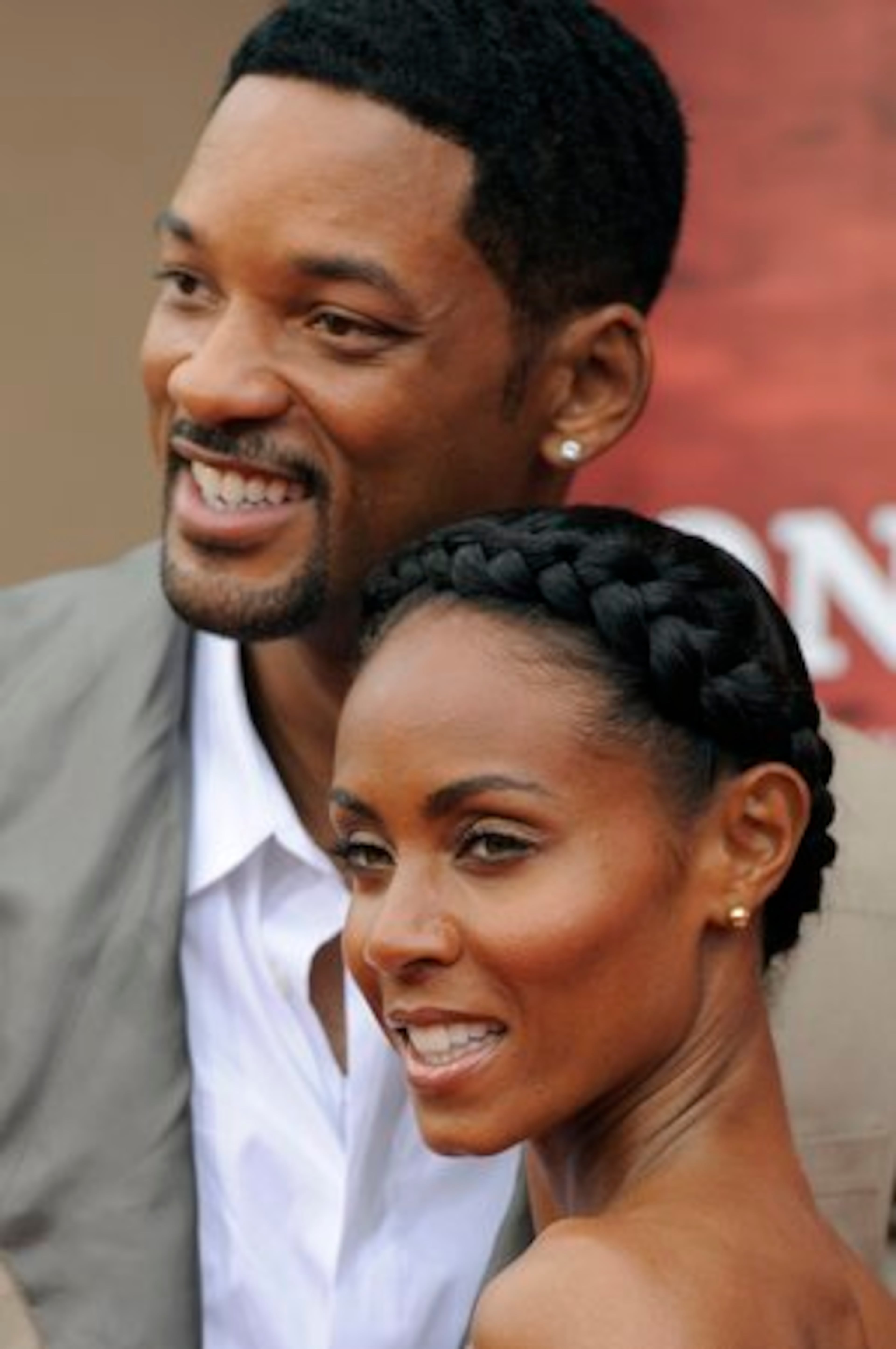 Will Smith, left, and his wife Jada Pinkett Smith, producers of a re-make of "The Karate Kid, " pose together at the premiere of the film in Los Angeles.