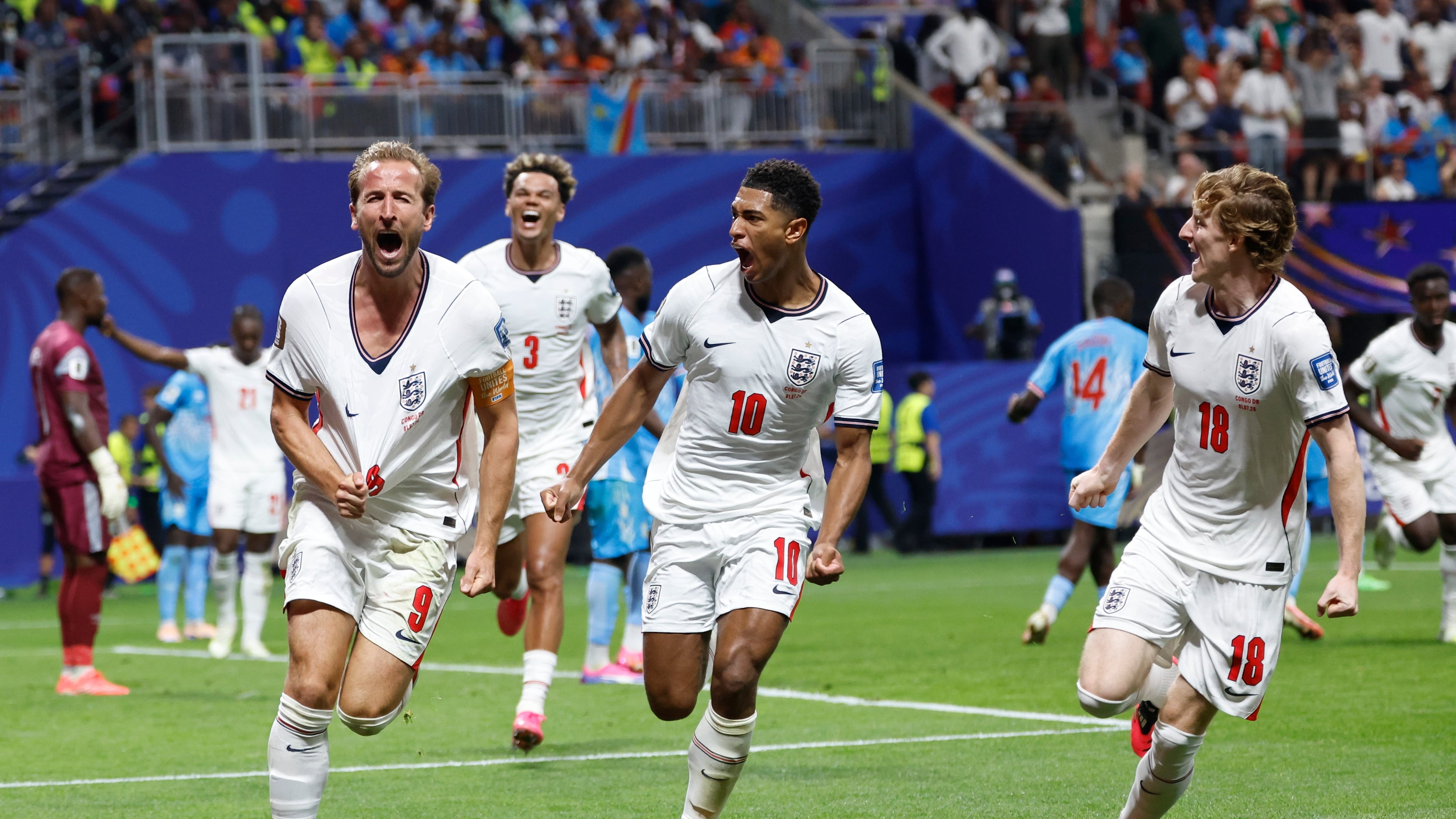 England's Harry Kane (9) celebrates after scoring his side's first goal next to his teammate Jude Bellingham (10) and Anthony Gordon (18) during the World Cup round of 32 soccer match between England and Congo in Atlanta, Wednesday, July 1, 2026. (AP Photo/Butch Dill)