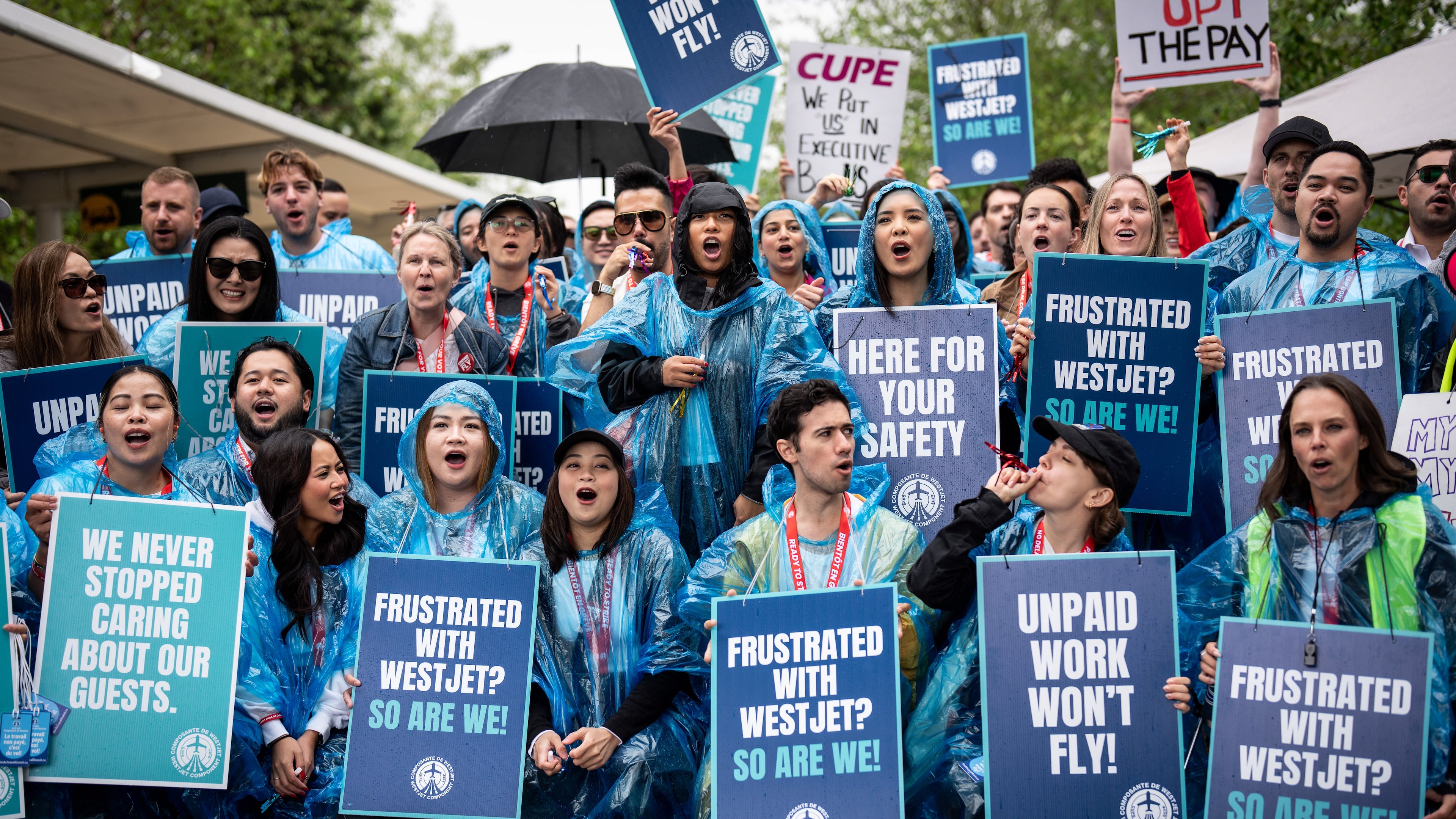 WestJet flight attendants strike at Vancouver International Airport in Richmond, British Columbia, Sunday, Aug. 2, 2026. (Ethan Cairns/The Canadian Press via AP)