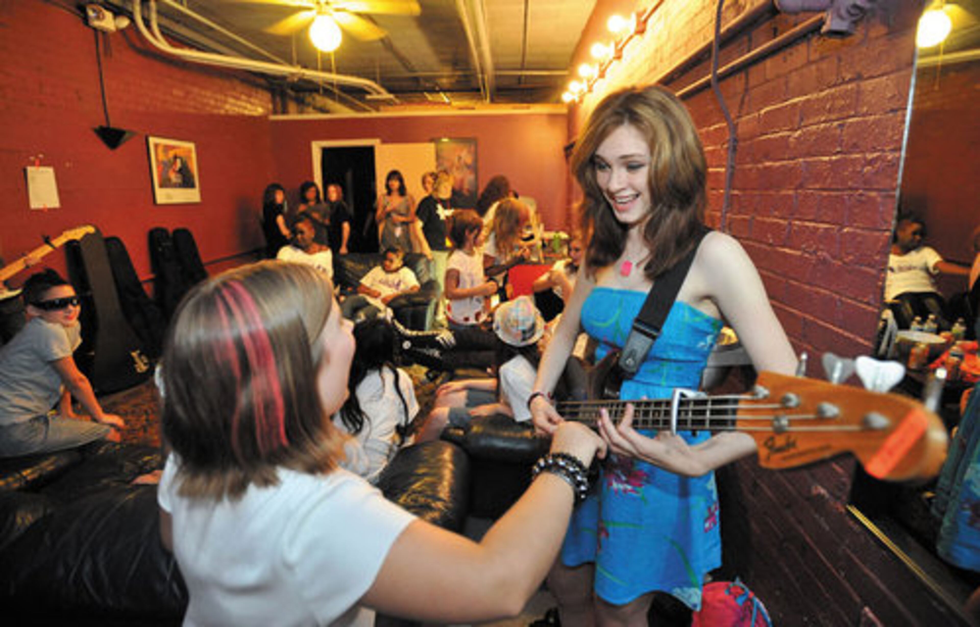 Sydney Rhame (right), 11, shares a laugh with McCall Pitts, 10, as Sydney warm up before the show starts.