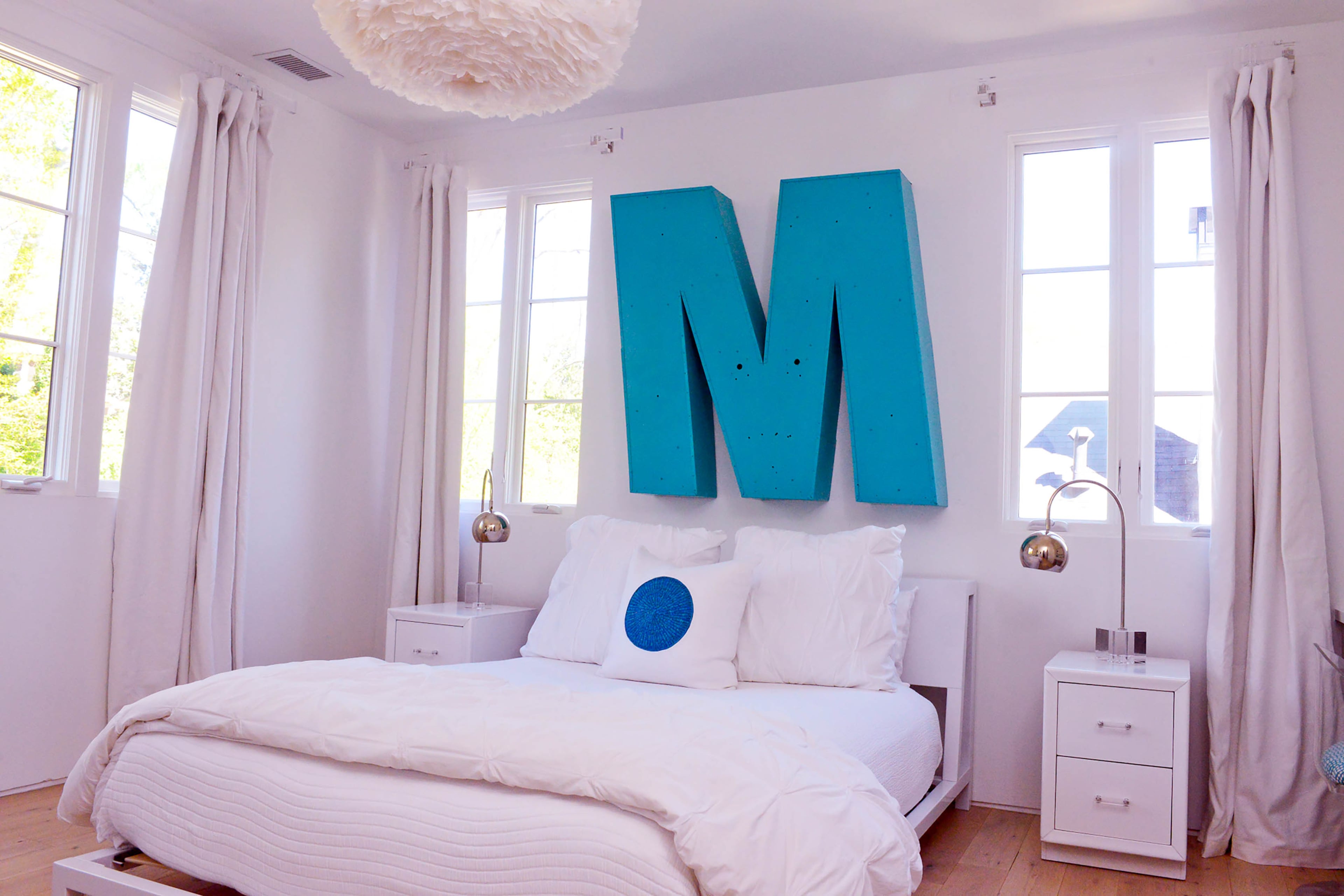 A turquoise M hangs above 12-year-old Millie's bed, creating an eyecatching centerpiece in her bedroom. "My favorite thing in my room is the big M," she said. "It gives my room character, and it is very unique."