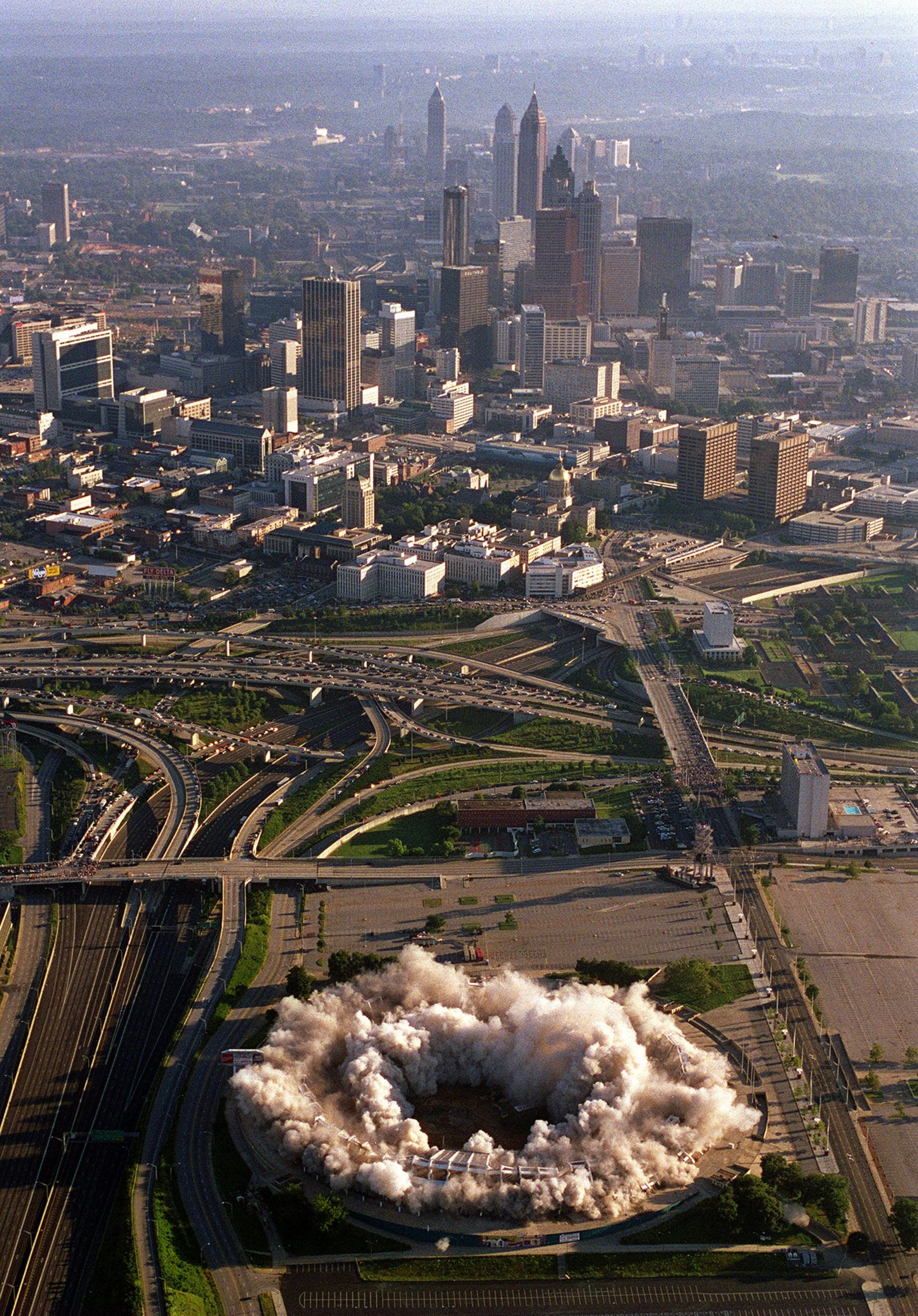 970802 - Atlanta, Georgia - Aerial view of the implosion of Atlanta Fulton County Stadium 8/2/97. The city skyline is in the background. (AJC Staff Photo/Jean Shifrin)