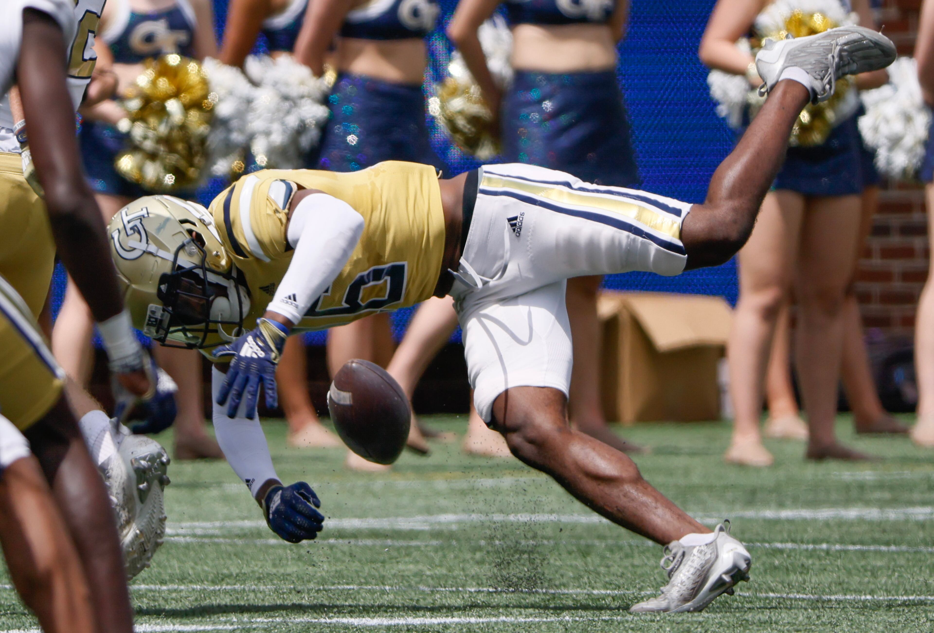 Defensive back K.J. Wallace (16) tries to control a pass during Georgia Tech's spring football game in Atlanta on Saturday, April 15, 2023. (Bob Andres for the Atlanta Journal Constitution)