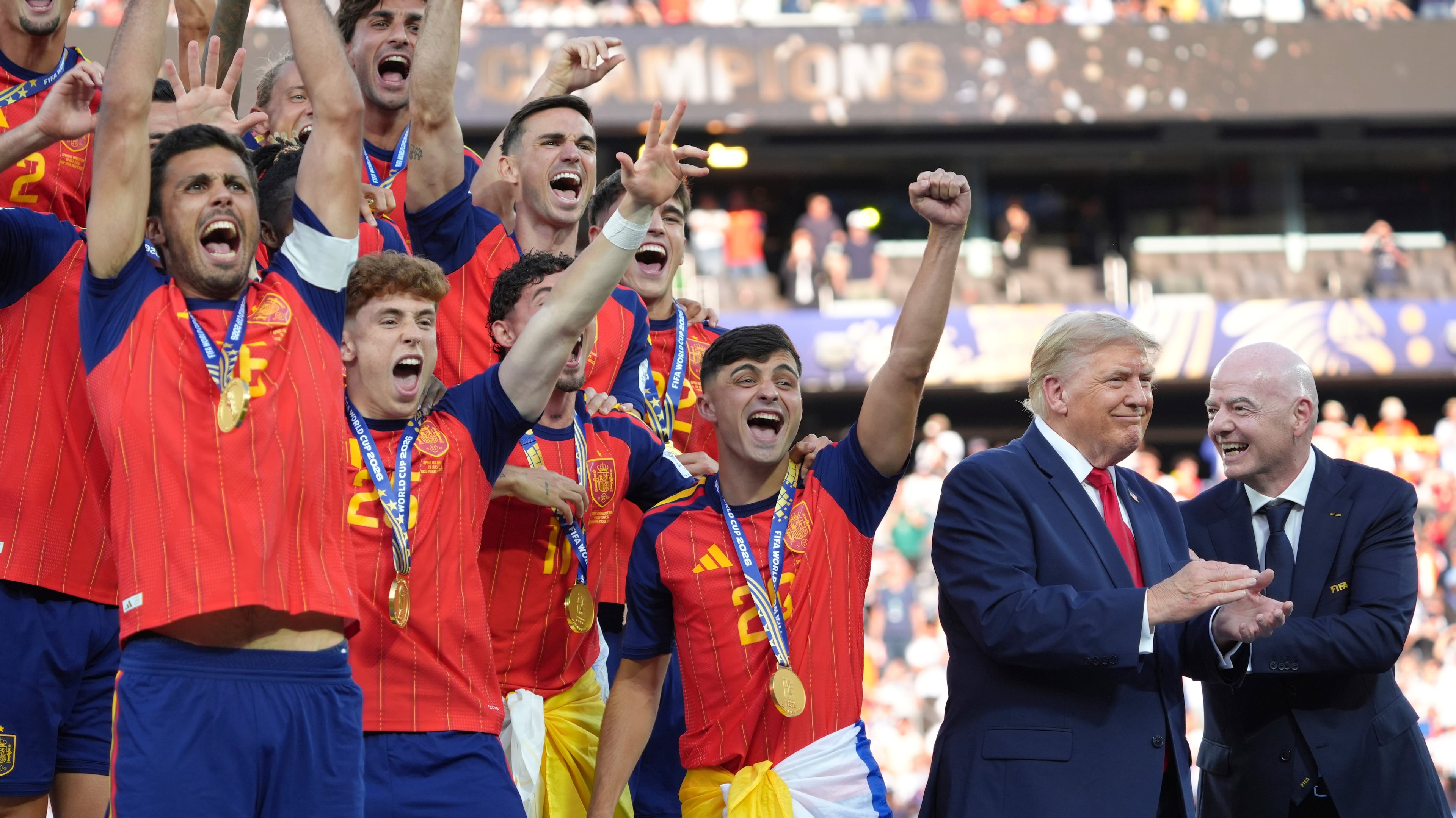 Spain players, from left, cheer alongside President Donald Trump and FIFA President Gianni Infantino at the conclusion of the World Cup championship final soccer match between Spain and Argentina in East Rutherford, N.J., Sunday, July 19, 2026. (AP Photo/Jacquelyn Martin)