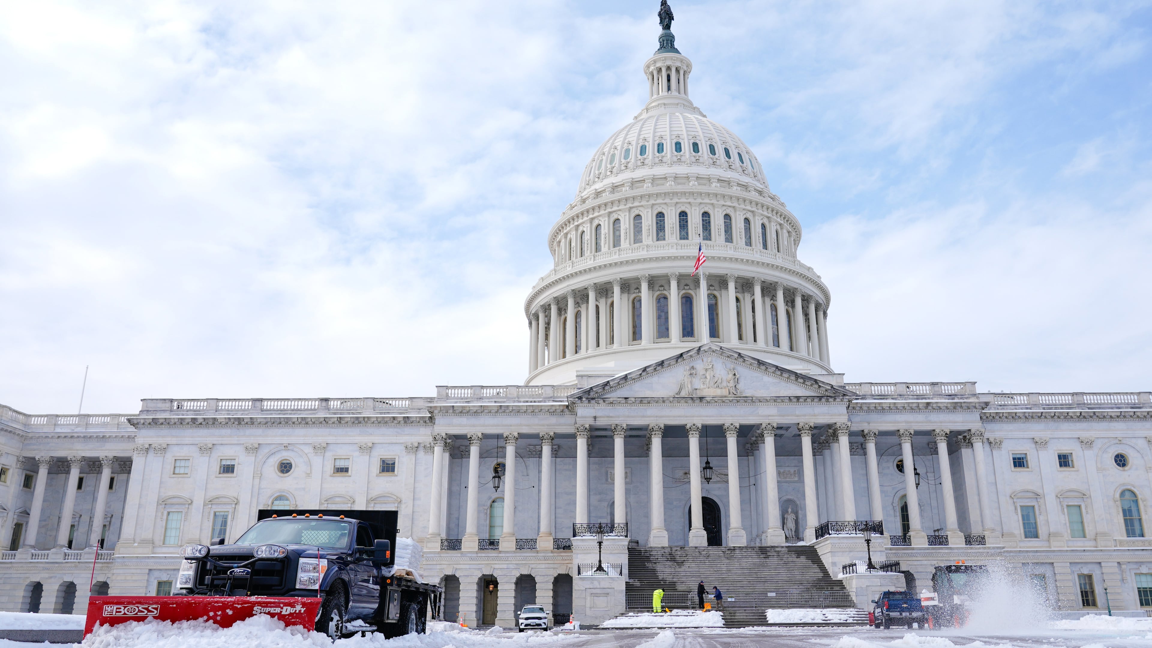 Workers clear the Capitol grounds after a snowstorm Monday, Jan. 26, 2026, in Washington. (AP Photo/Mariam Zuhaib)