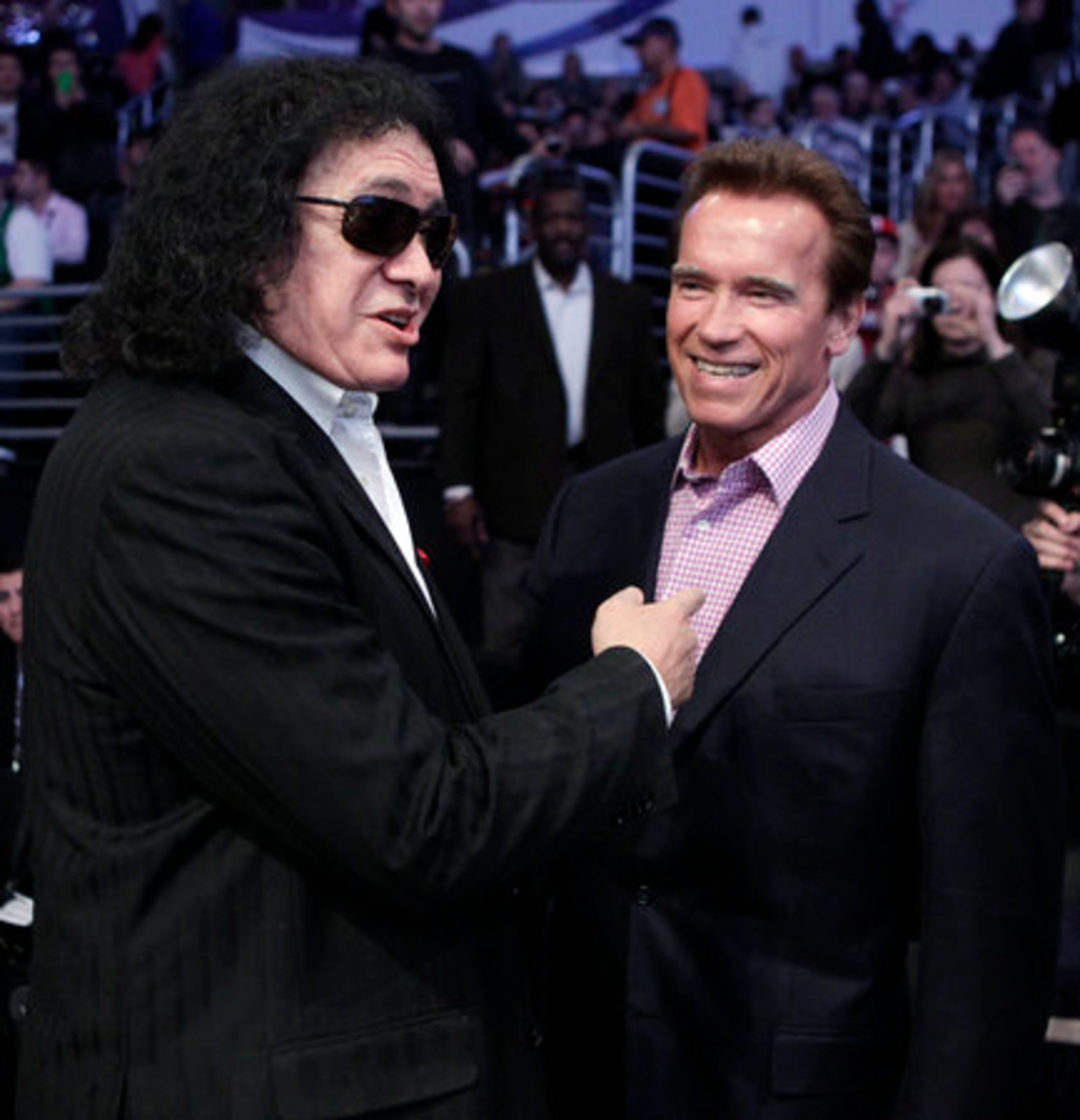 Gene Simmons of Kiss jokes around with former California Gov. Arnold Schwarzenegger prior to All-Star game.