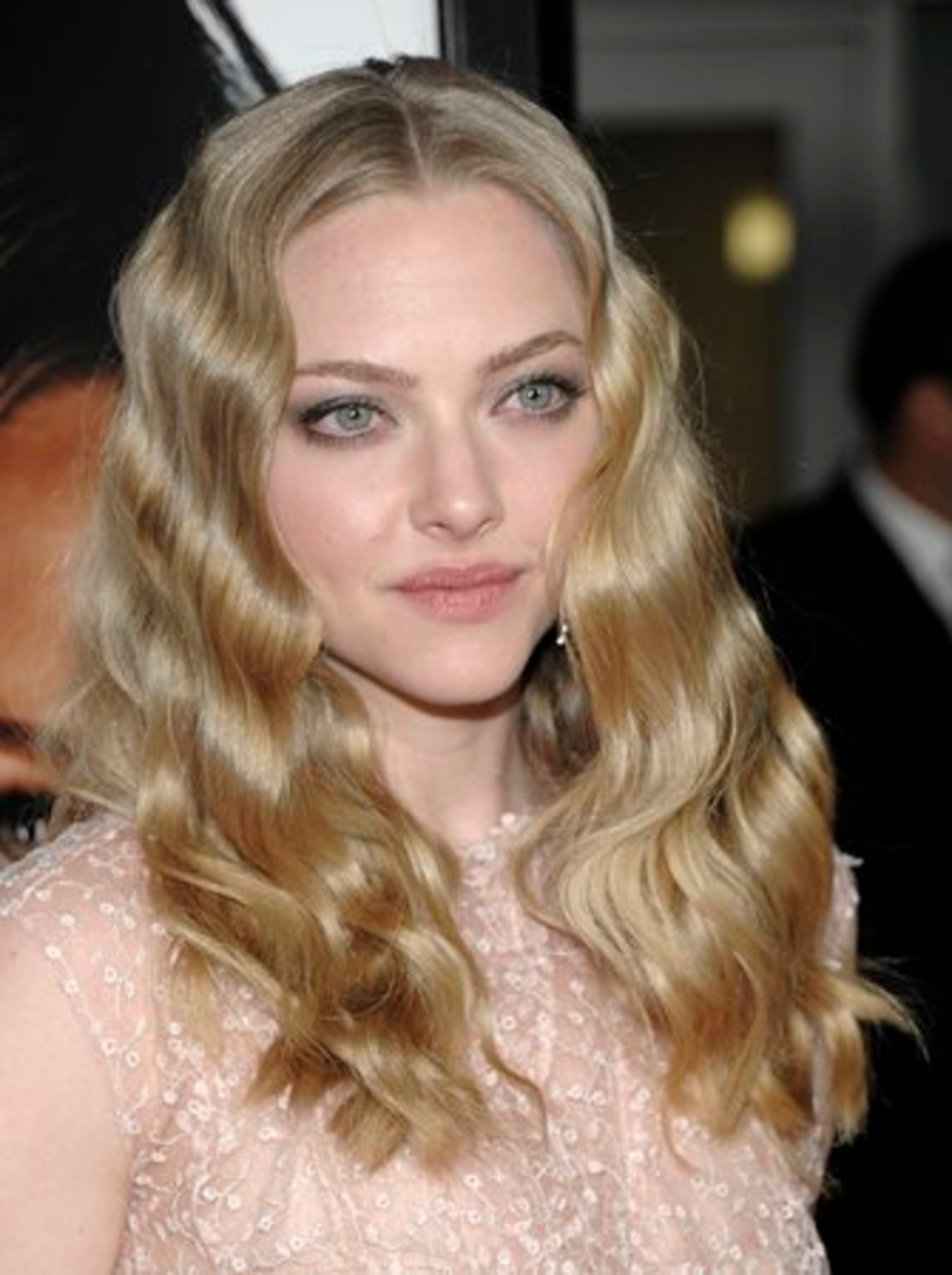 Amanda Seyfried arrives at the "Gone" premiere Tuesday, Feb. 21, 2012, in Los Angeles. In the film, Seyfried plays a woman stalking a serial killer who has abducted her sister.
