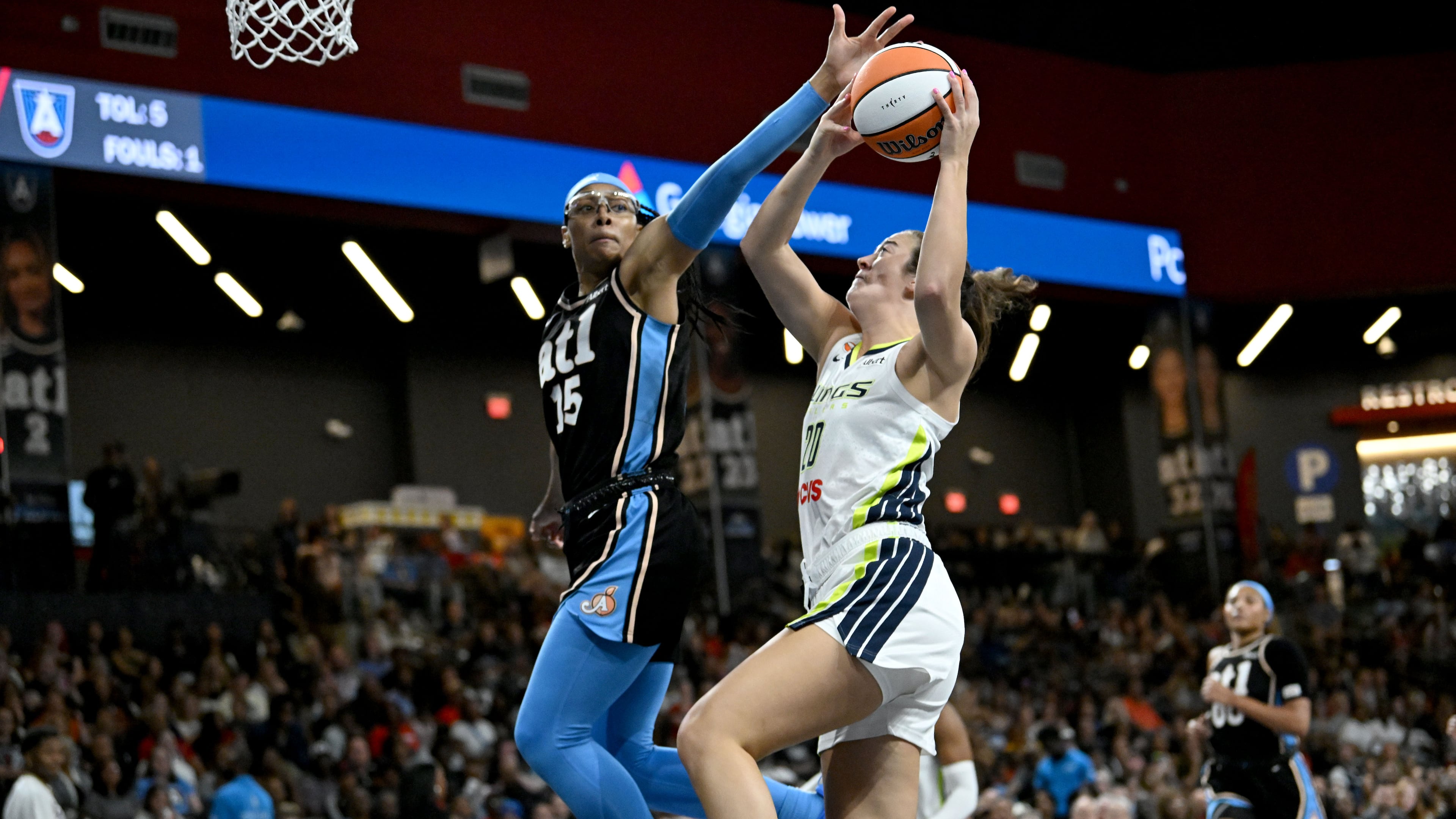 Atlanta Dream guard Allisha Gray (15) blocks a shot by Dallas Wings forward Maddy Siegrist (20) during the first half in a WNBA basketball game at Gateway Center Arena on Friday, May 22, 2026, in Atlanta. (Hyosub Shin/AJC)