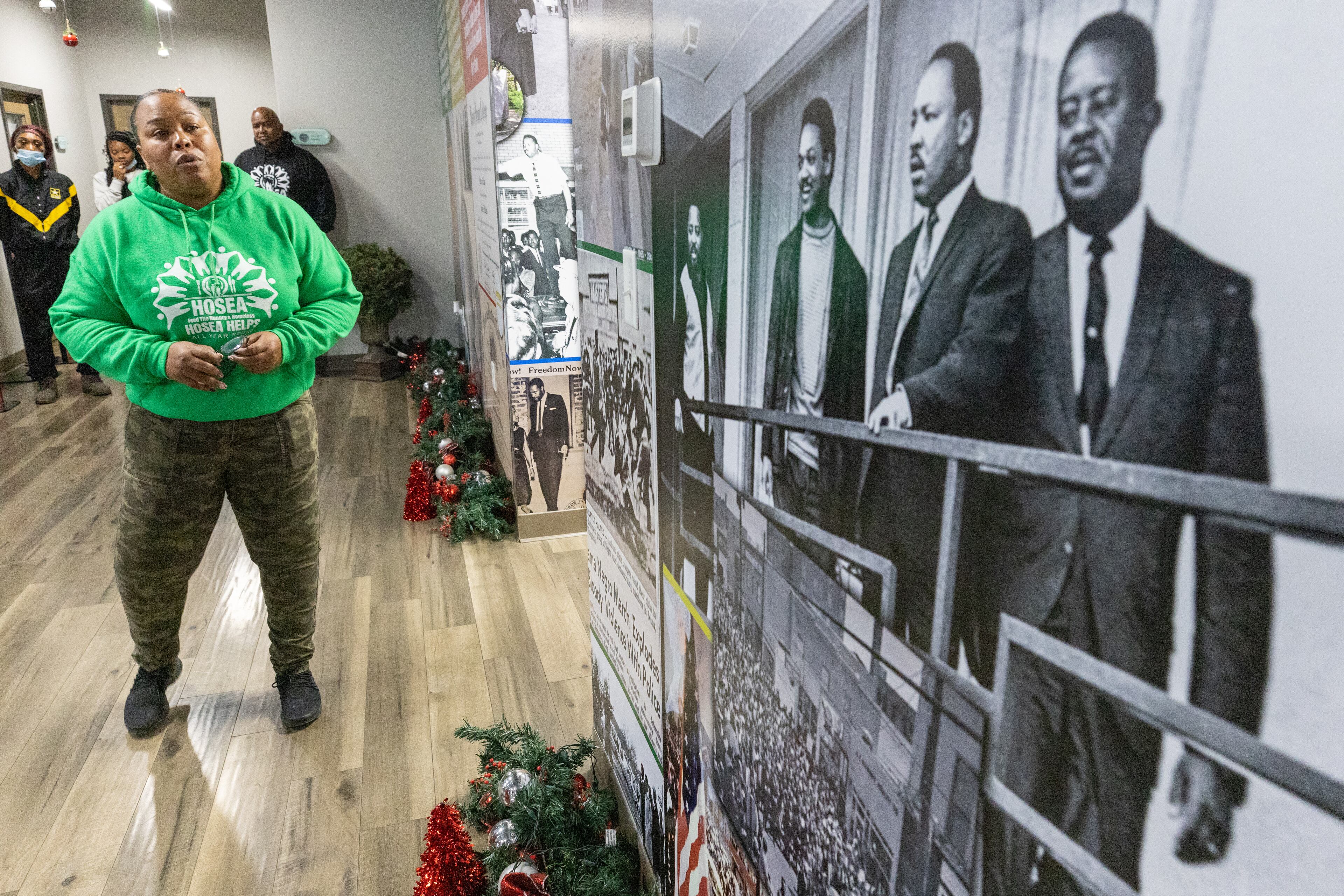 Volunteer coordinator Tiffanni Forbes talks to volunteers about the life of Hosea Williams at the Hosea Helps headquarters in Atlanta on Thursday, November 24, 2022. (Steve Schaefer/steve.schaefer@ajc.com)
