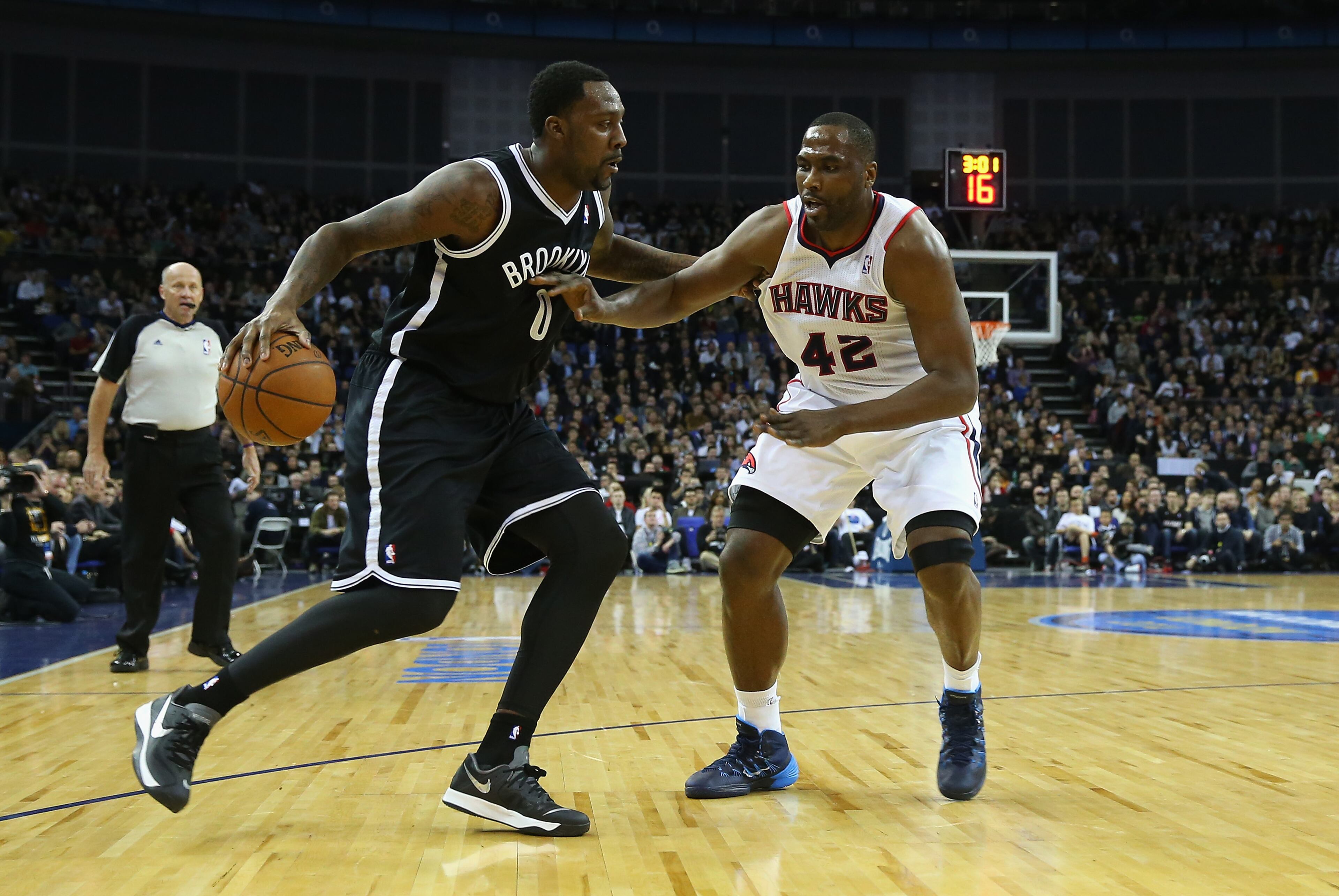Andray Blatche of Brooklyn and Elton Brand in action during the Eastern Conference NBA match between Brooklyn Nets and Atlanta Hawks at O2 Arena on January 16, 2014 in London, England.