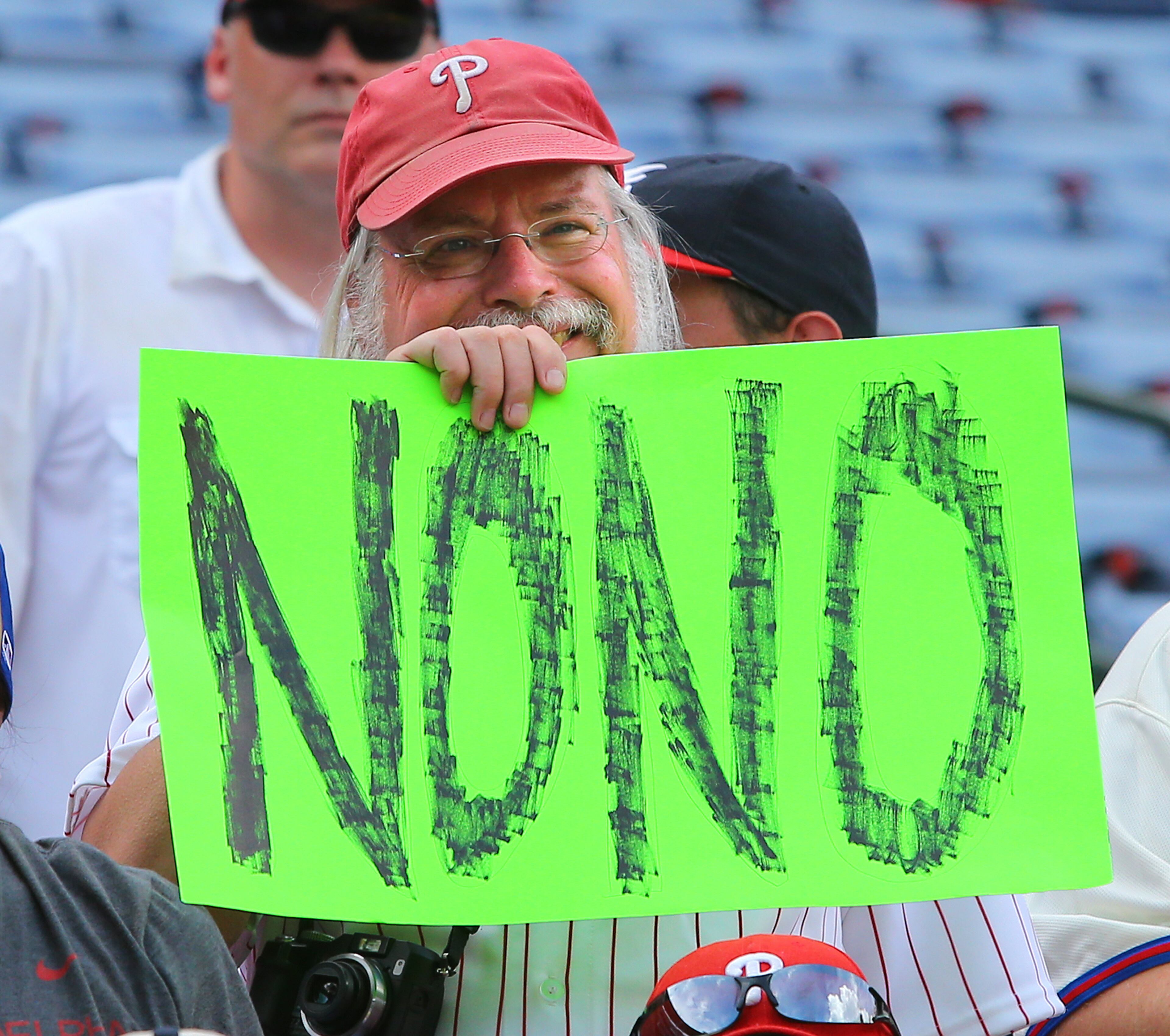 A Phillies fan holds a No No sign after four Phillies pitchers combined to pitch a 7-0 no hitter against the Braves in a baseball game in Atlanta on Monday, Sept. 1, 2014. Phillies pitchers Cole Hamels, Ken Giles, Jonathan Papelbon, and Jake Diekman combined to pitch the 7-0 no hitter with Hamels going six innings against the Braves. CURTIS COMPTON / CCOMPTON@AJC.COM CURTIS COMPTON / CCOMPTON@AJC.COM