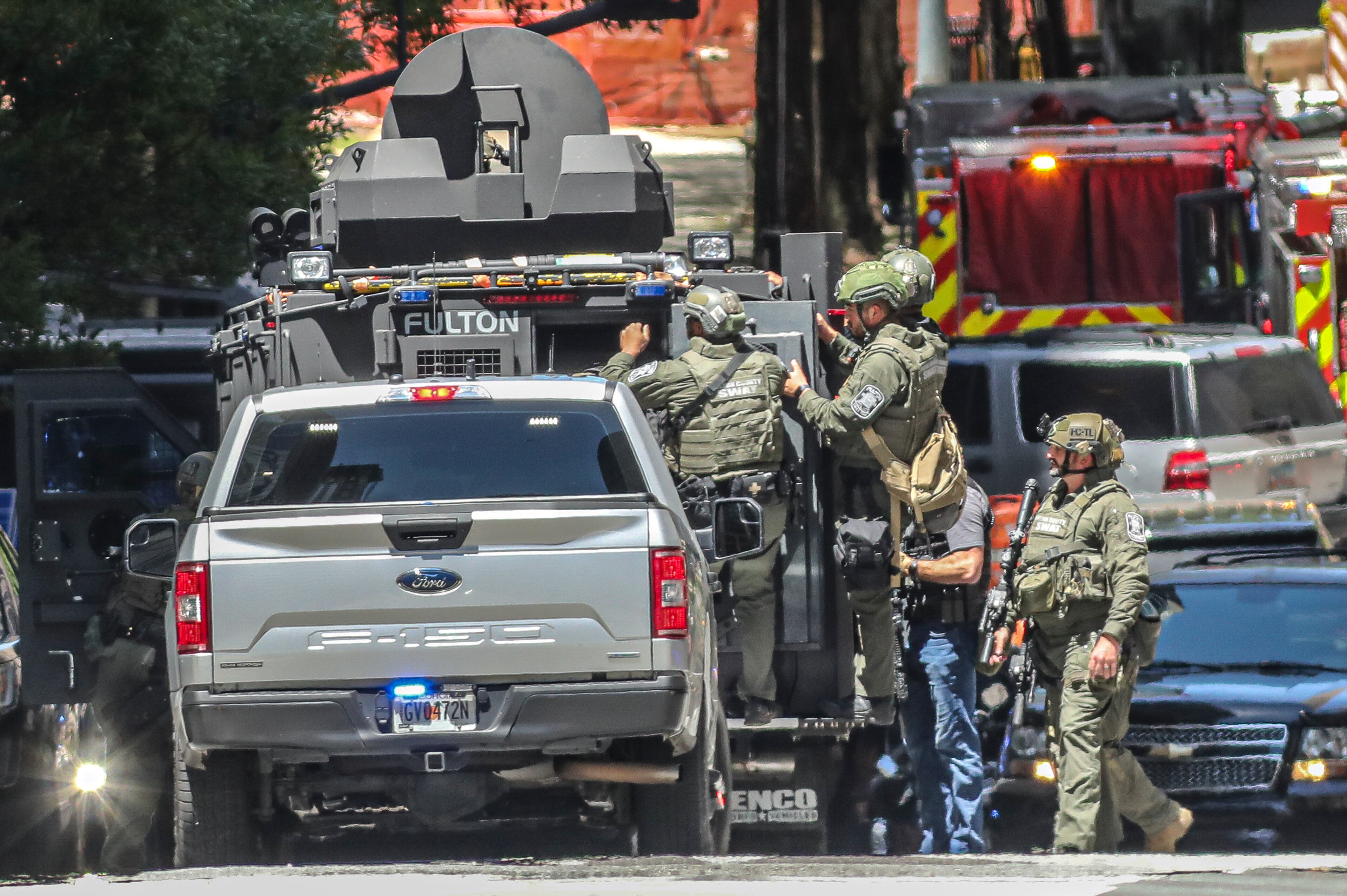 May 5, 2023 Atlanta: West Peachtree Street. Atlanta police and a multi jurisdiction police force swarmed midtown Atlanta on Wednesday, May 3,2023 after 5 people were shot by an active shooter. The suspect tied to the shooting in Midtown that killed one person and injured four was identified by authorities. Deion Patterson, 24, remains at large and police said residents should not approach him, but instead immediately call 911. Those who may know him or know of his whereabouts are also advised to call police. Surveillance photos of the suspect were previously released by officials and depict a man wearing a gray sweatshirt, dark pants and a medical mask carrying what appears to be a black gun. A bag or some other item is strapped to his chest. (John Spink / John.Spink@ajc.com)