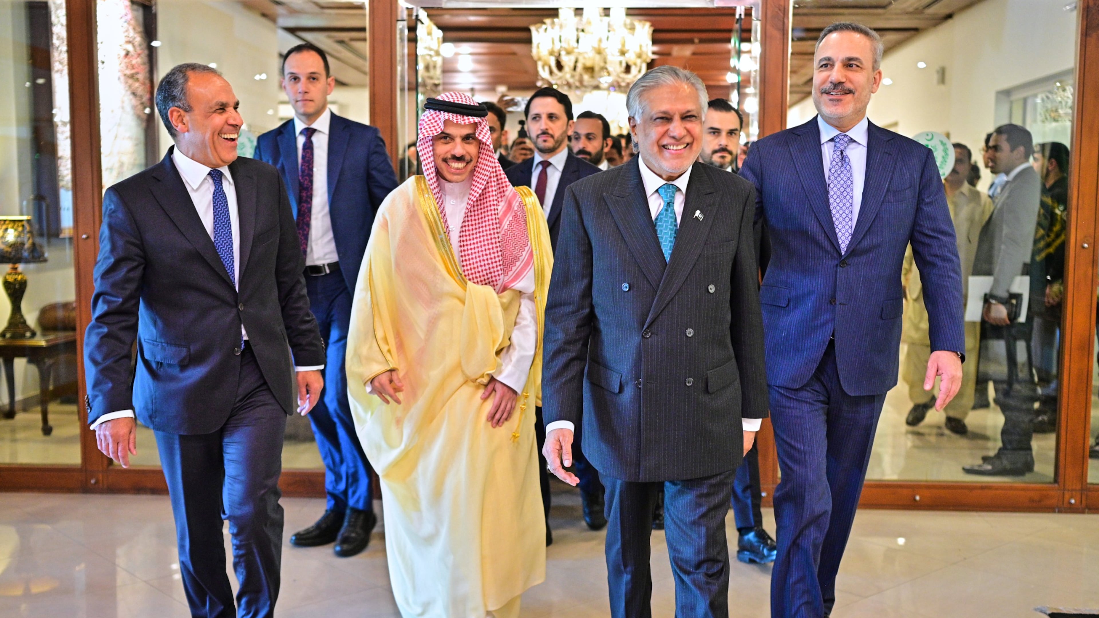 In this photo released by the Pakistan Ministry of Foreign Affairs, from left, Egyptian Foreign Minister Badr Abdelatty, Saudi Arabia's Foreign Minister Prince Faisal bin Farhan Al-Saud, Pakistan's Foreign Minister Ishaq Dar and Turkish Foreign Minister Hakan Fidan walk prior to their meeting to discuss the Middle East war, in Islamabad, Pakistan, Sunday, March 29, 2026. (Pakistan Ministry of Foreign Affairs via AP)