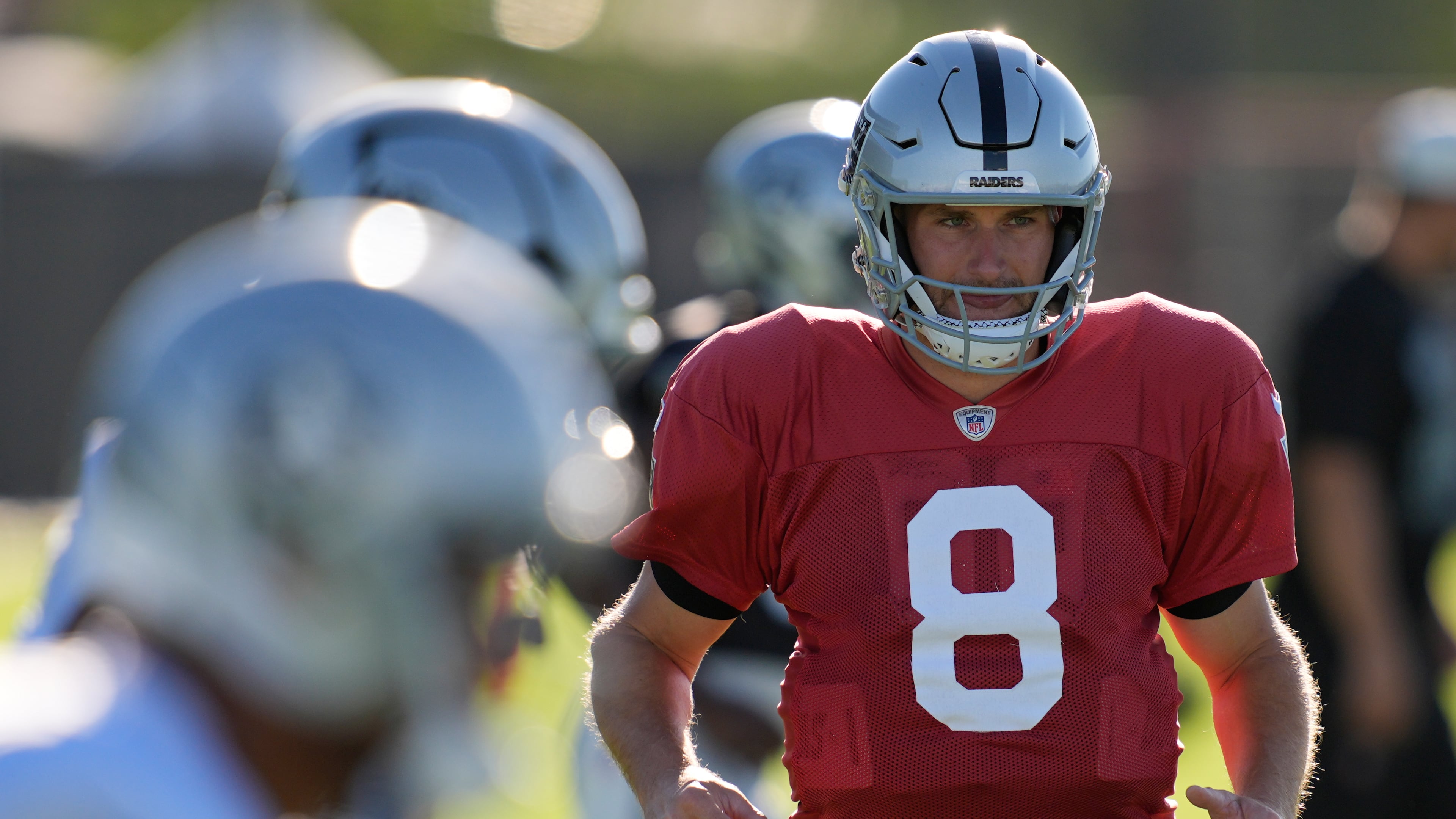 Las Vegas Raiders quarterback Kirk Cousins (8) warms up during practice at the team's NFL football training camp Tuesday, Aug. 4, 2026, in Henderson, Nev. (AP Photo/John Locher)