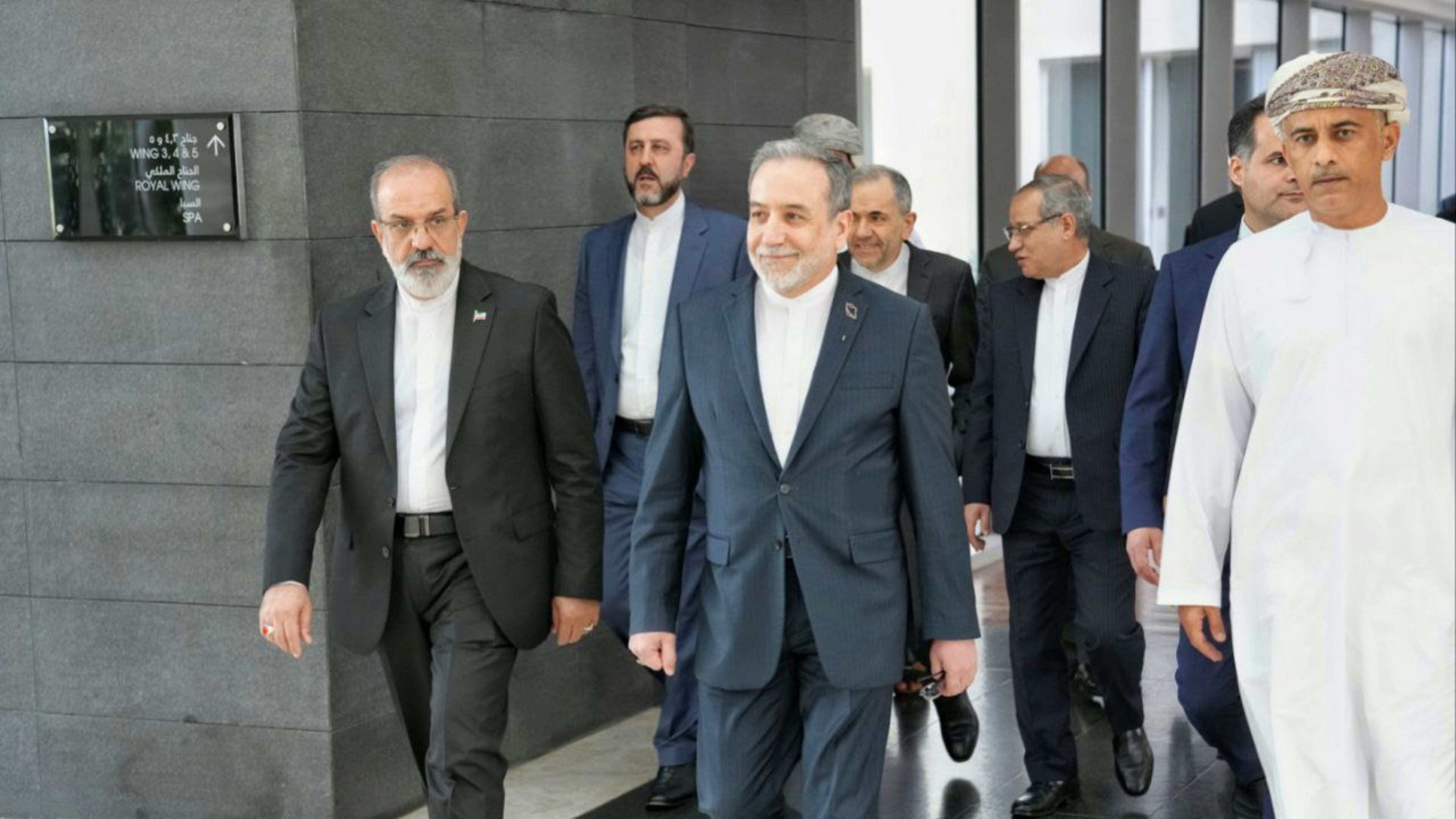 In this photo released by the Iranian Foreign Ministry, Iranian Foreign Minister Abbas Araghchi, center, heads to venue for talks between Iran and the U.S., in Muscat, Oman, Friday, Feb. 6, 2026. (Iranian Foreign Ministry via AP)