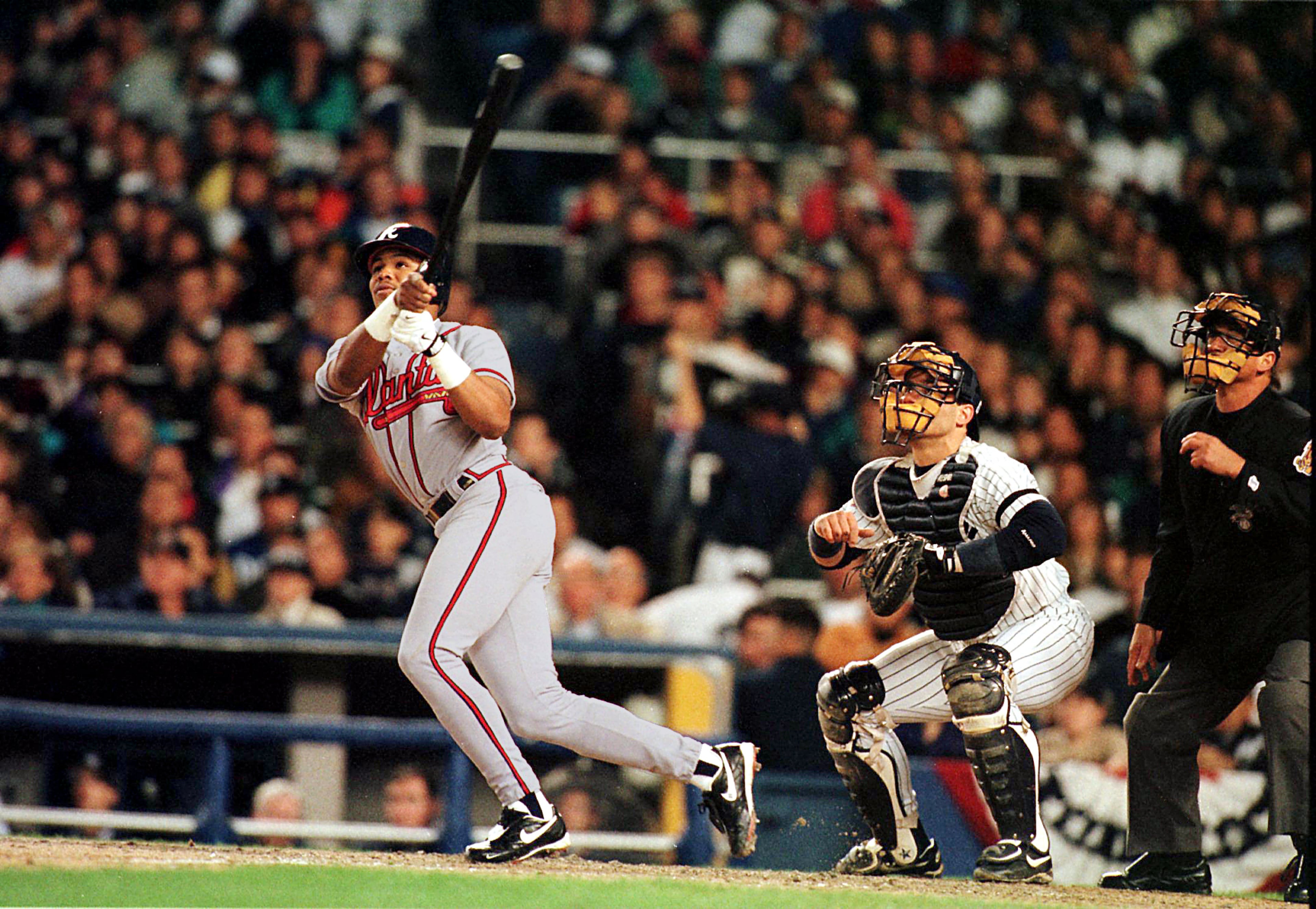 Braves center fielder Andruw Jones watches his two-run home run leave the park during Game 1 of the 1996 World Series between the Braves and the Yankees on Sunday, Oct. 20, 1996, in New York. (Johnny Crawford/AJC)