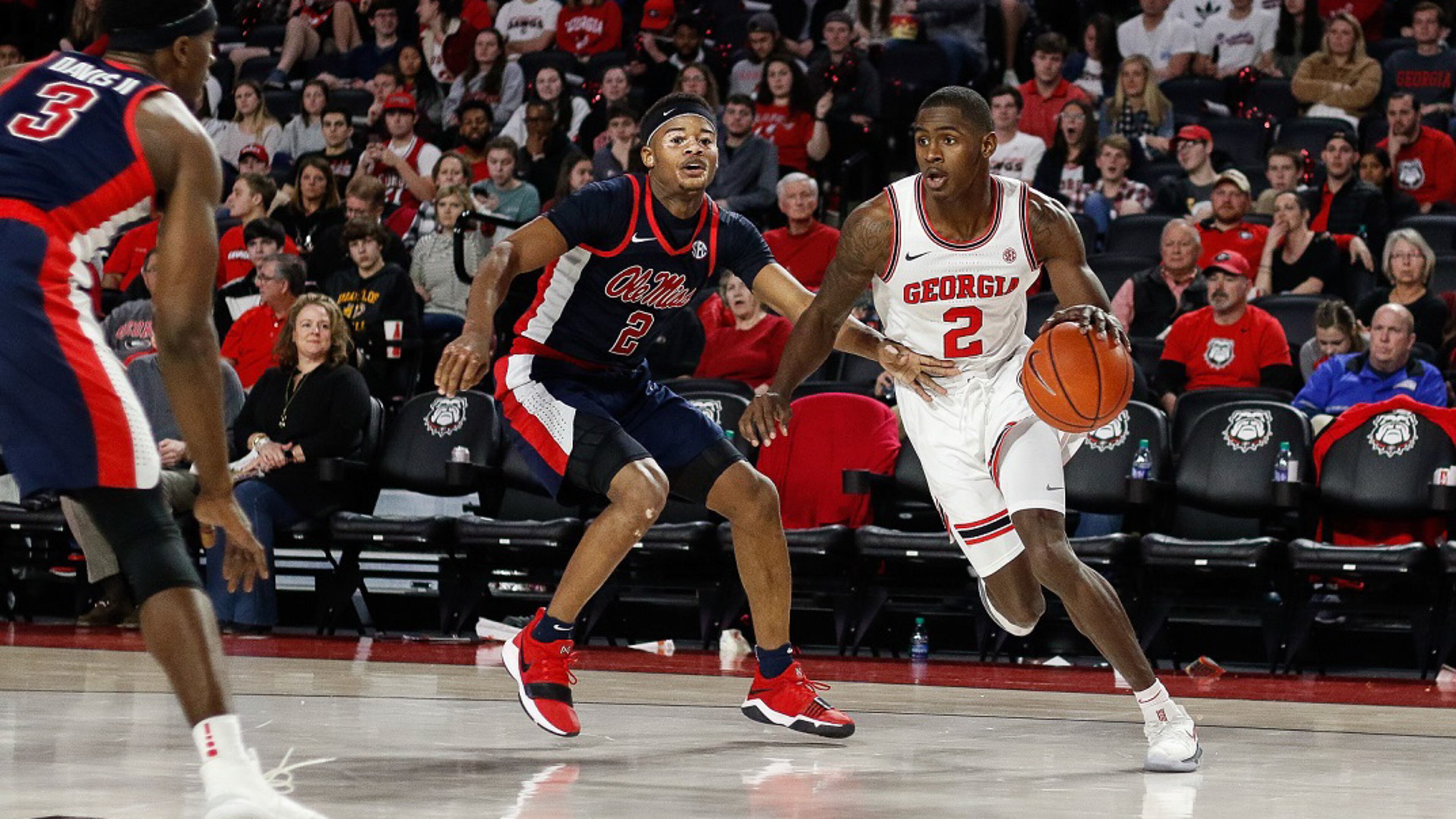 Georgia guard Jordan Harris (2) drives past Ole Miss guard Devontae Shuler (2) during game between the University of Georgia and the University of Mississippi at Stegeman Coliseum on Saturday, Feb. 9, 2019. (Photo by Kristin M. Bradshaw)