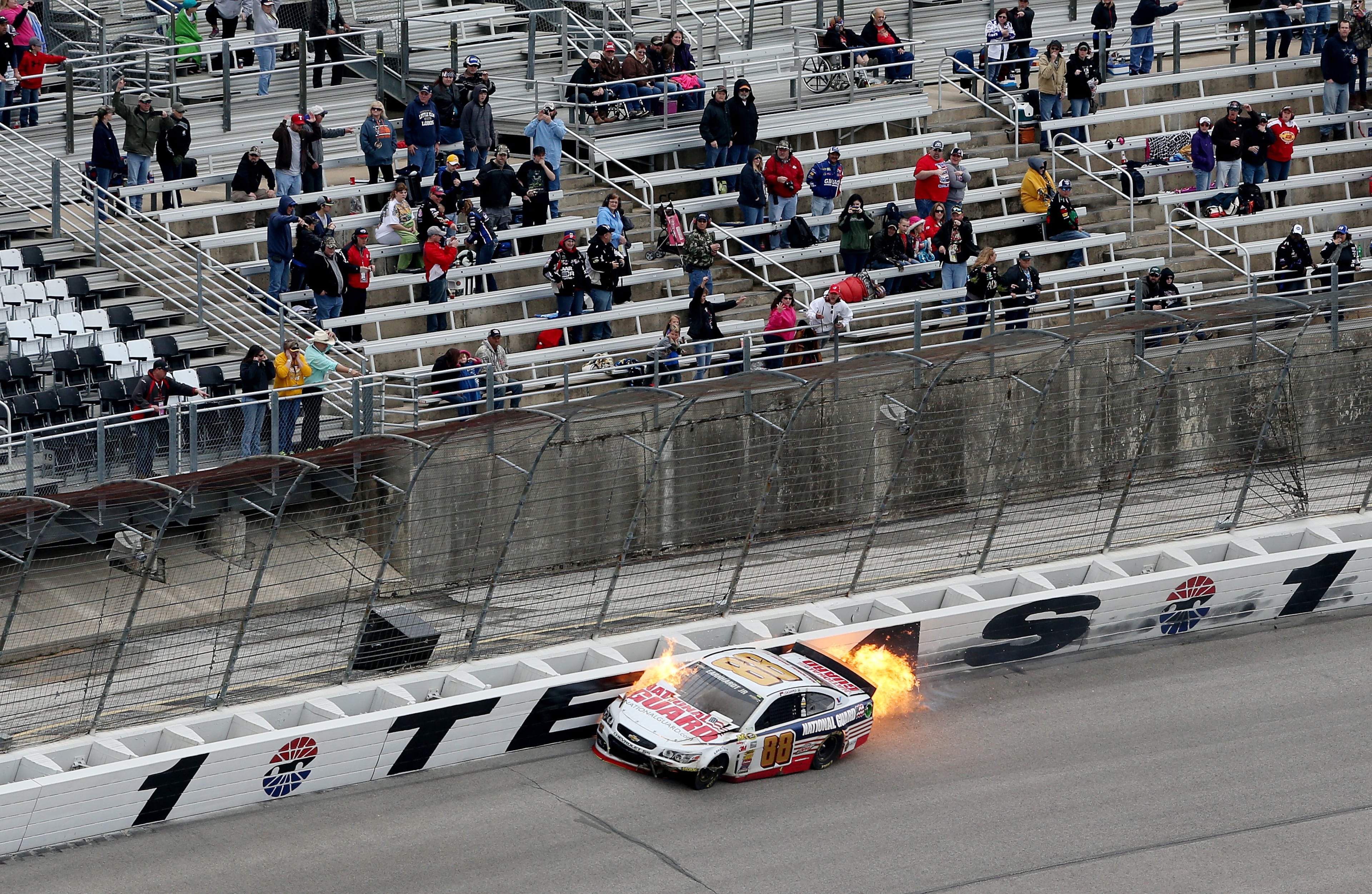 Dale Earnhardt Jr., driver of the #88 National Guard Chevrolet, crashes early in the NASCAR Sprint Cup Series Duck Commander 500 at Texas Motor Speedway on April 7, 2014 in Fort Worth, Texas. (Photo by Nick Laham/Getty Images for Texas Motor Speedway)